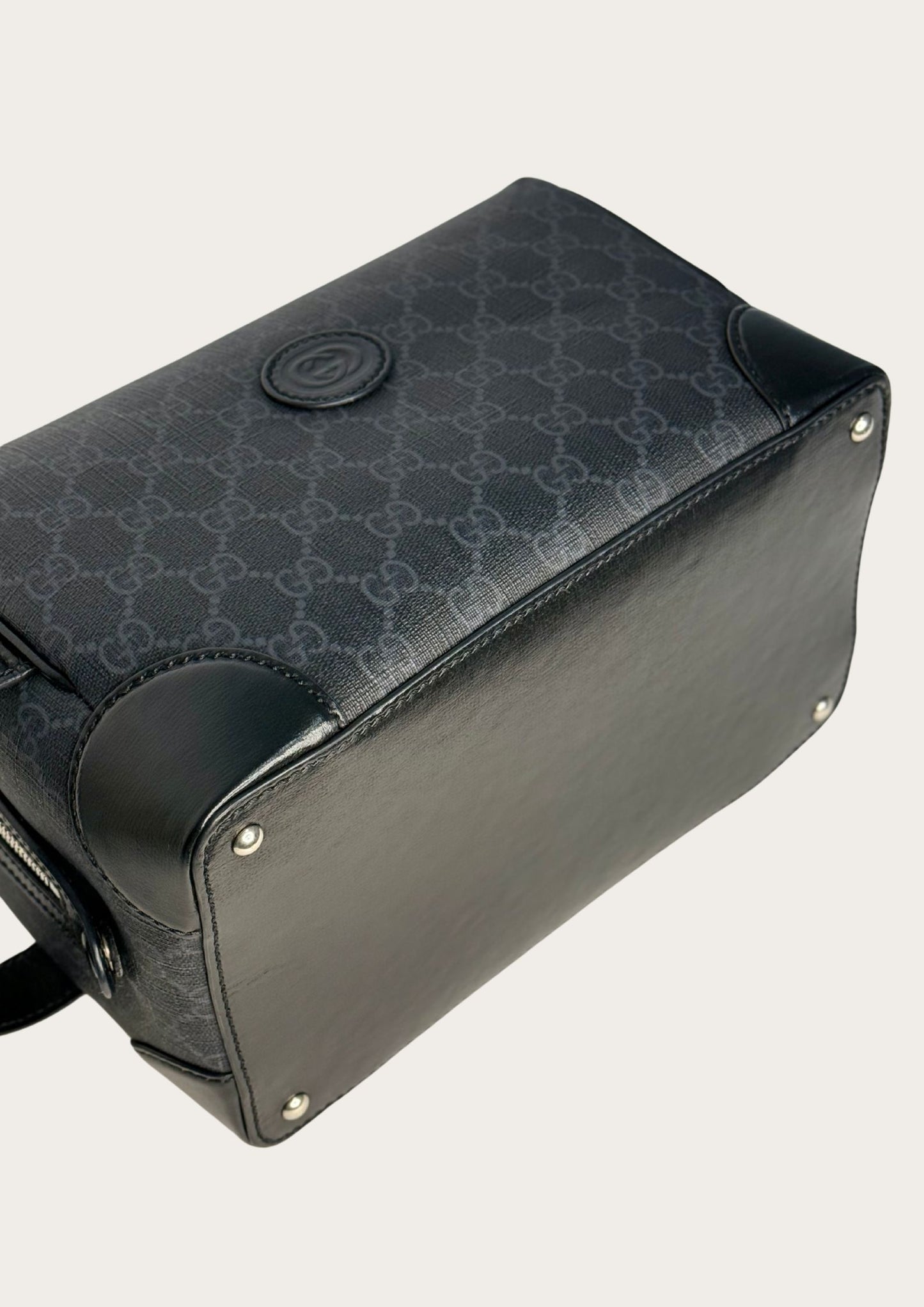 Bottom of Pre-owned Gucci Ophidia toiletry case in supreme leather with black leather details.