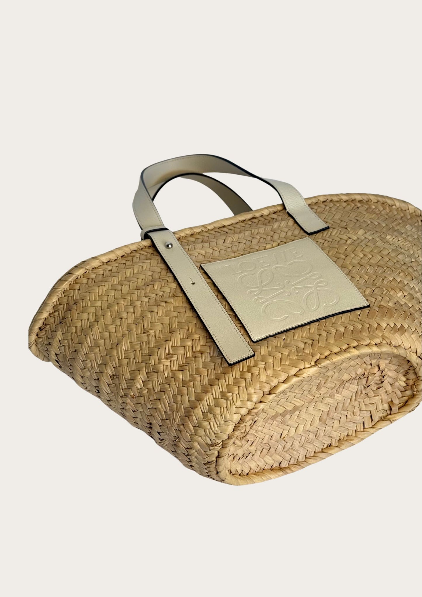Pre-owned Loewe basket bag in straw with white leather details.