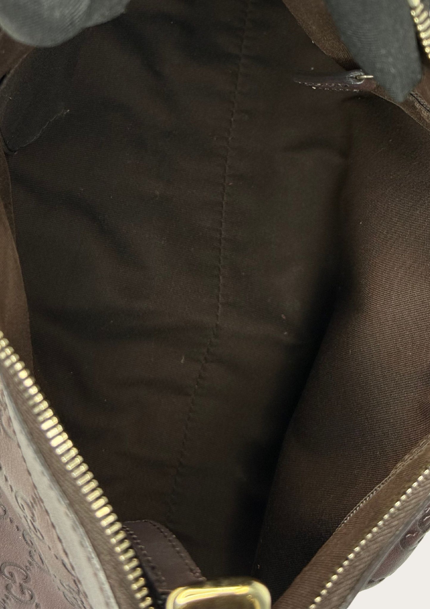 Inside of Gucci Guccissima GG D-ring Abbey in brown leather with gold details, authentic