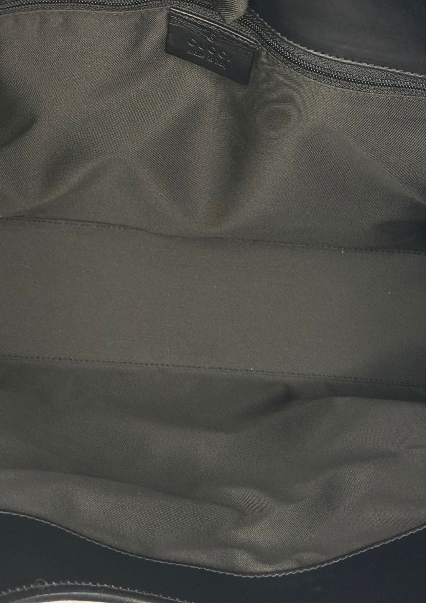 Inside of Vintage Gucci Jackie Bardot large in GG pattern with leather details, black.