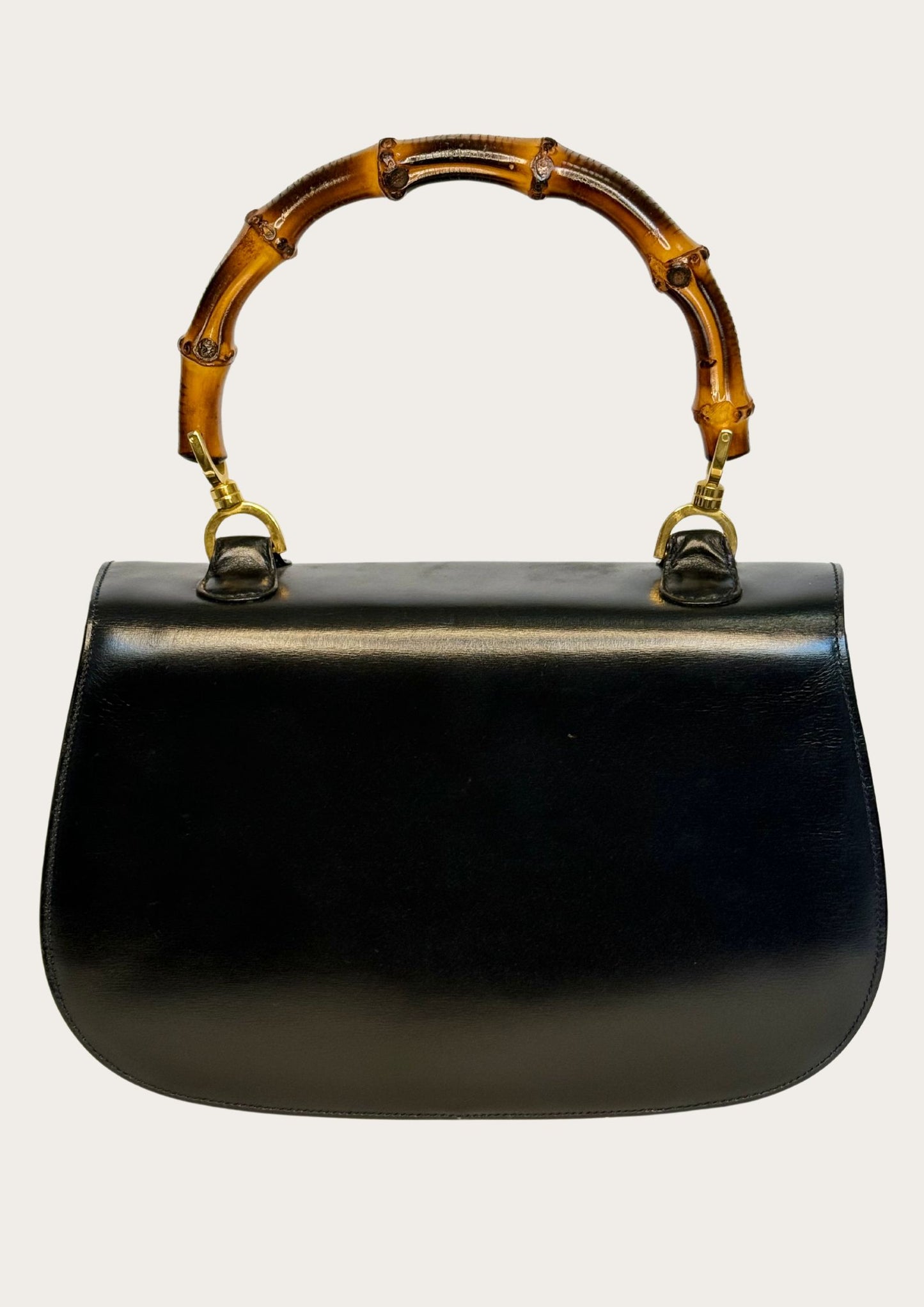 Vintage and authentic Gucci Convertible bamboo top handle bag in black leather