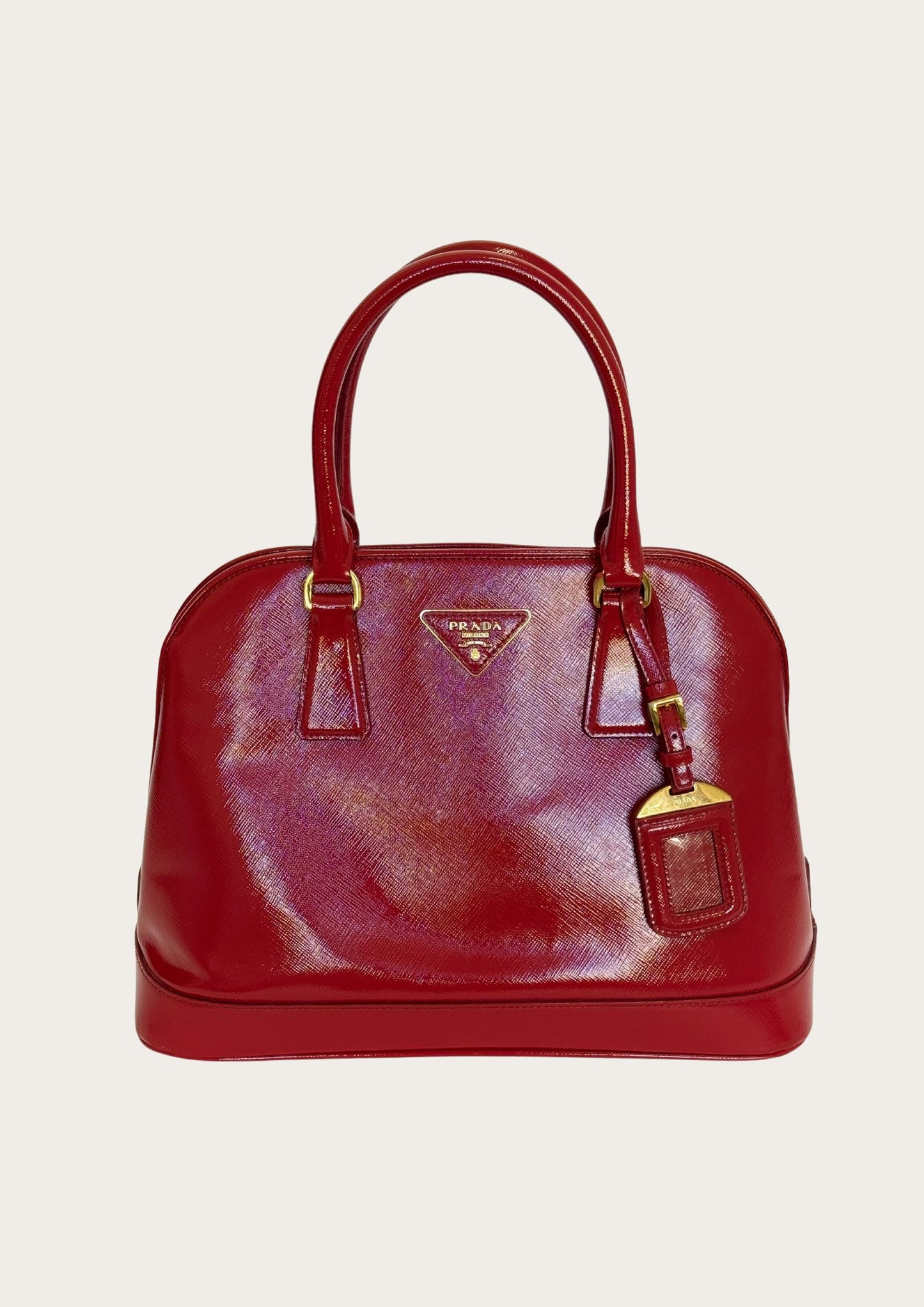 Genuine and classic Prada Saffiano handbag in bright red leather.