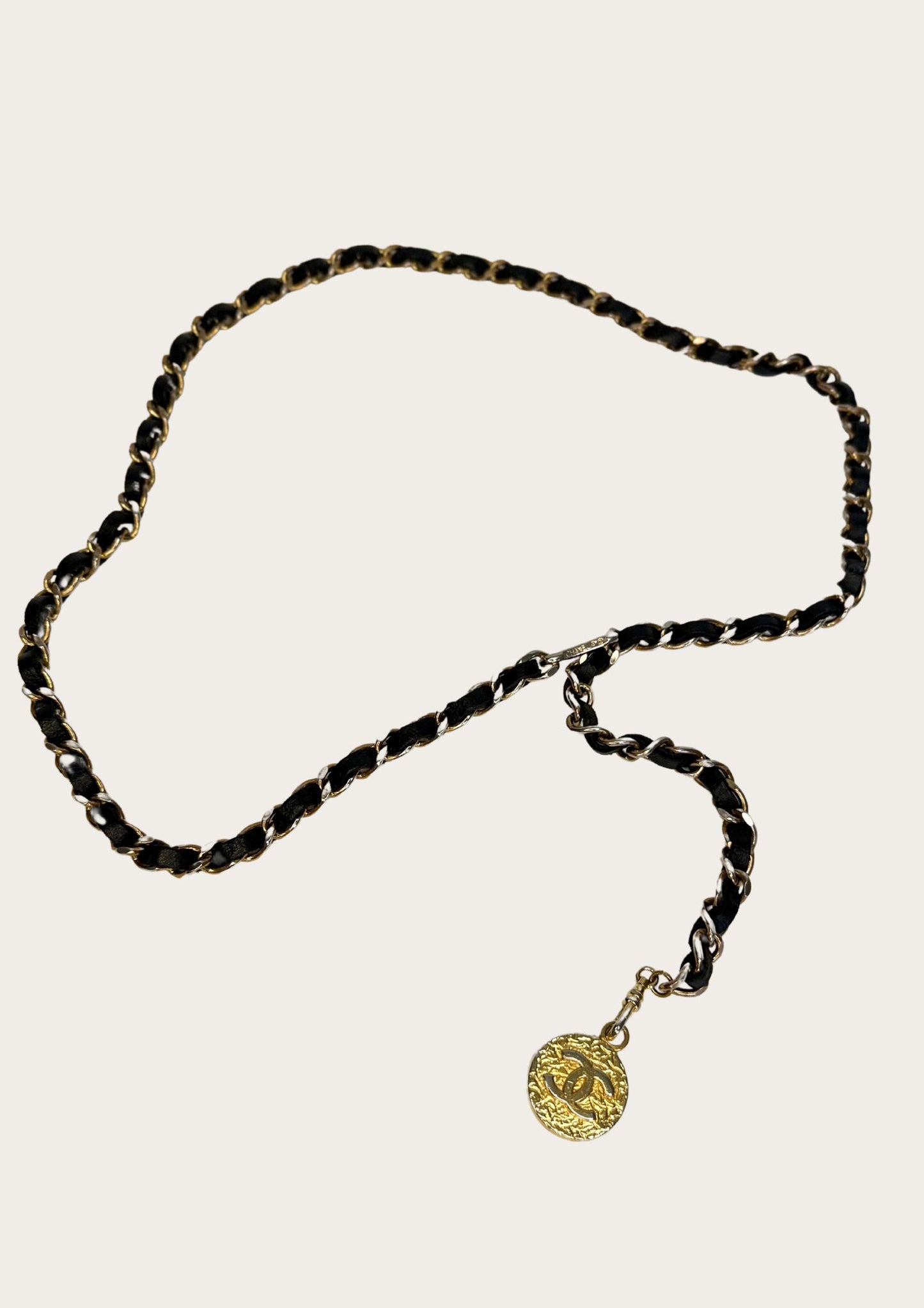 Vintage and authentic Chanel 1982 chain belt, black leather gold colored details