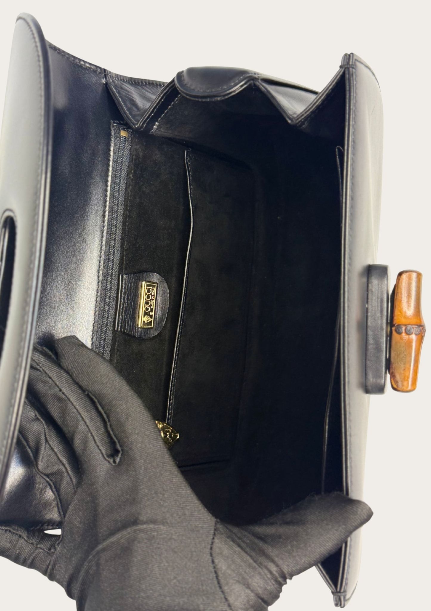 Vintage and authentic Gucci Bamboo Convertible handbag in black leather
