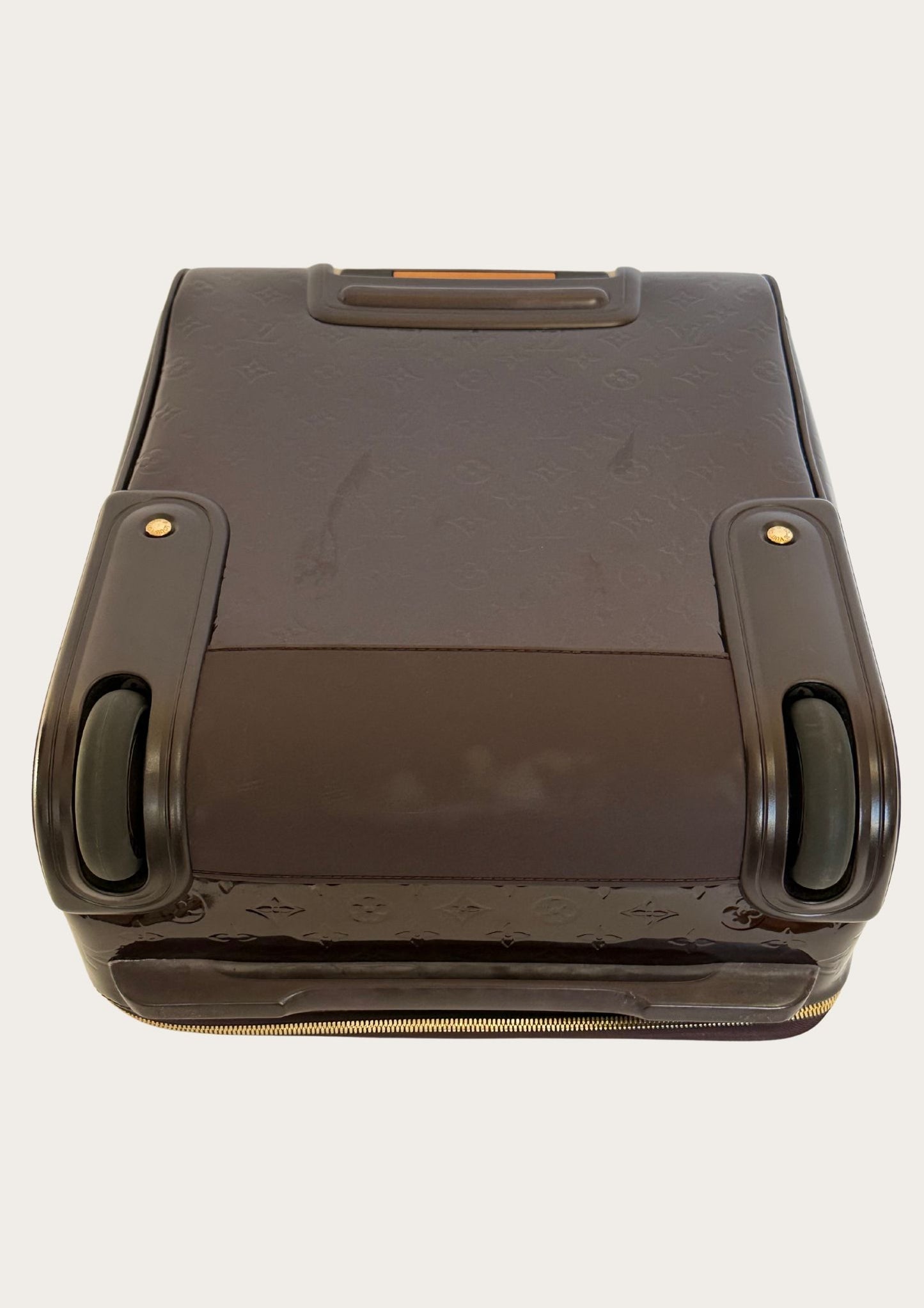 Vintage and authentic Louis Vuitton Pegase 45 cabin bag in burgundy patent leather