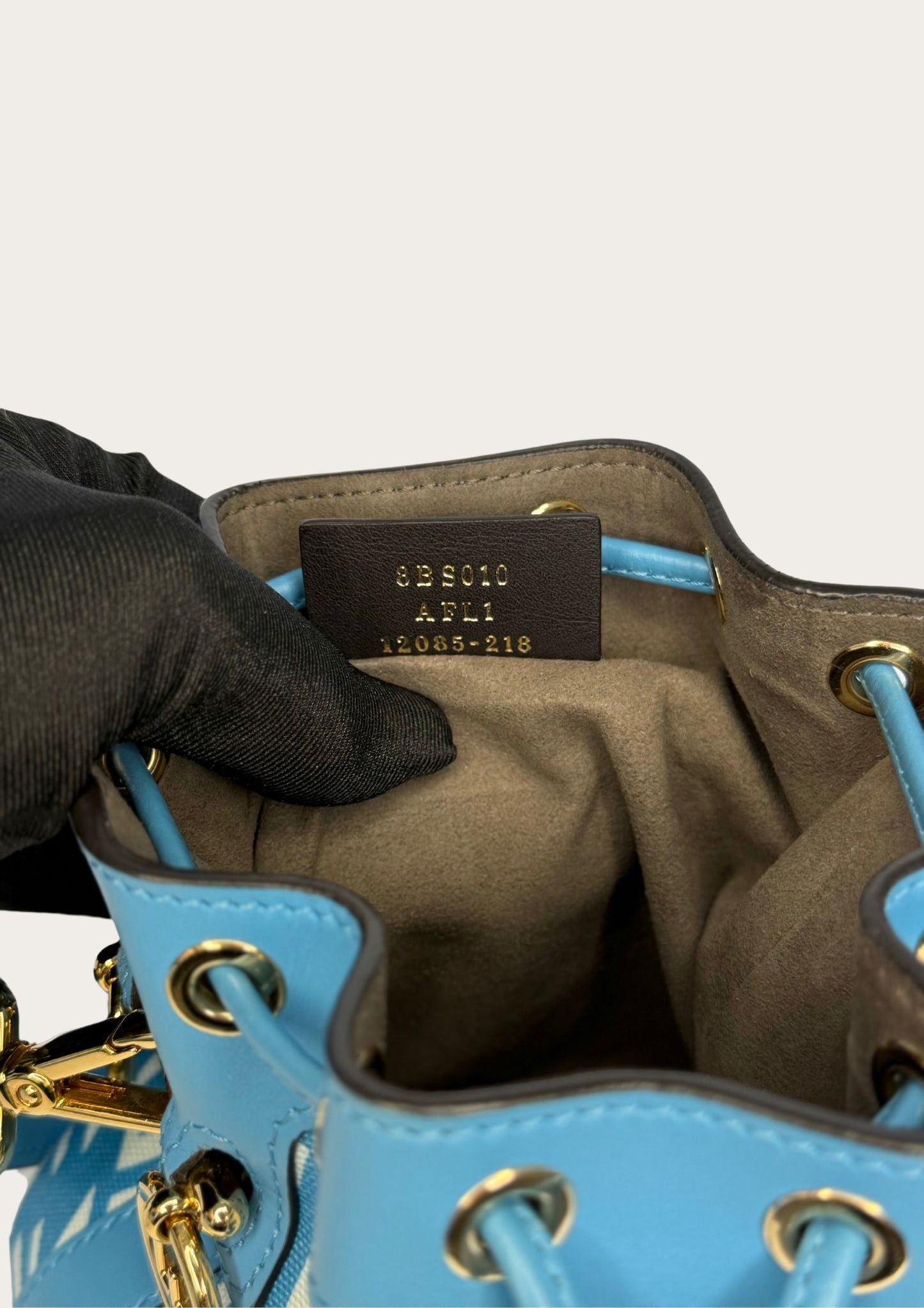 Authenticity code Light blue and white Fendi Mon Trésor mini bucket bag with FF pattern