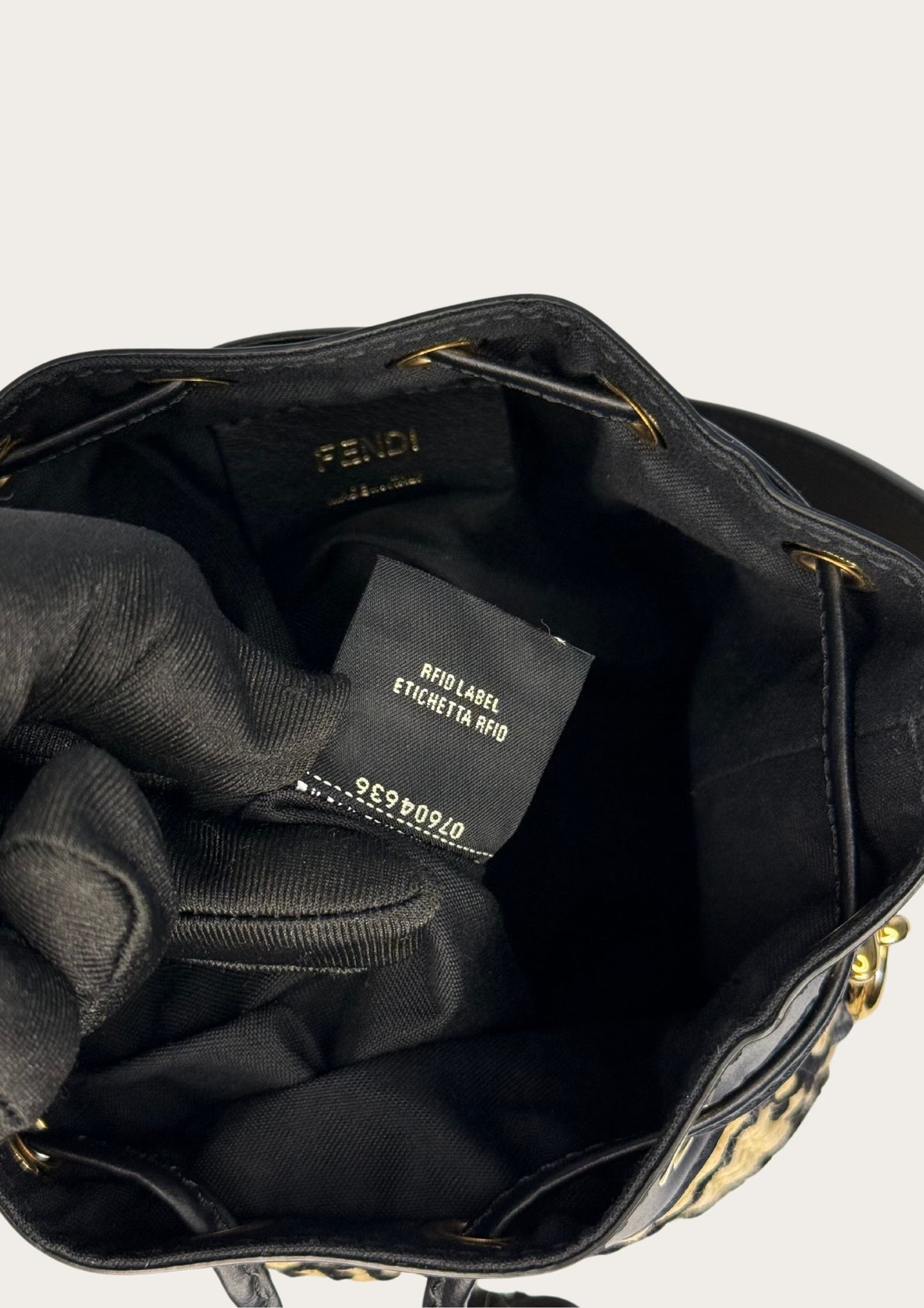 Authentic Fendi Mon Trésor mini bucket bag in raffia with black leather details