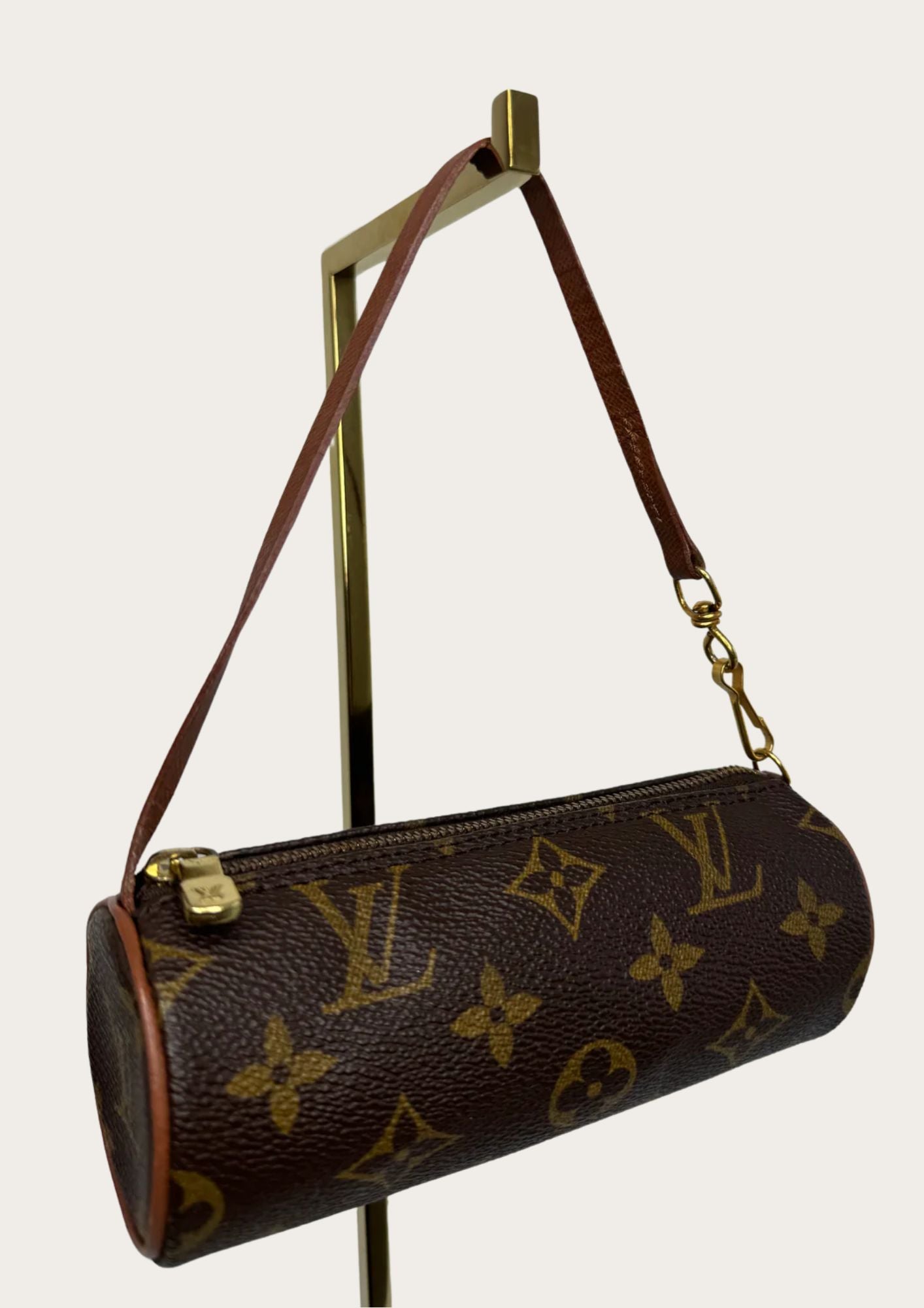Genuine Louis Vuitton Papillon pouch in monogram leather, side.