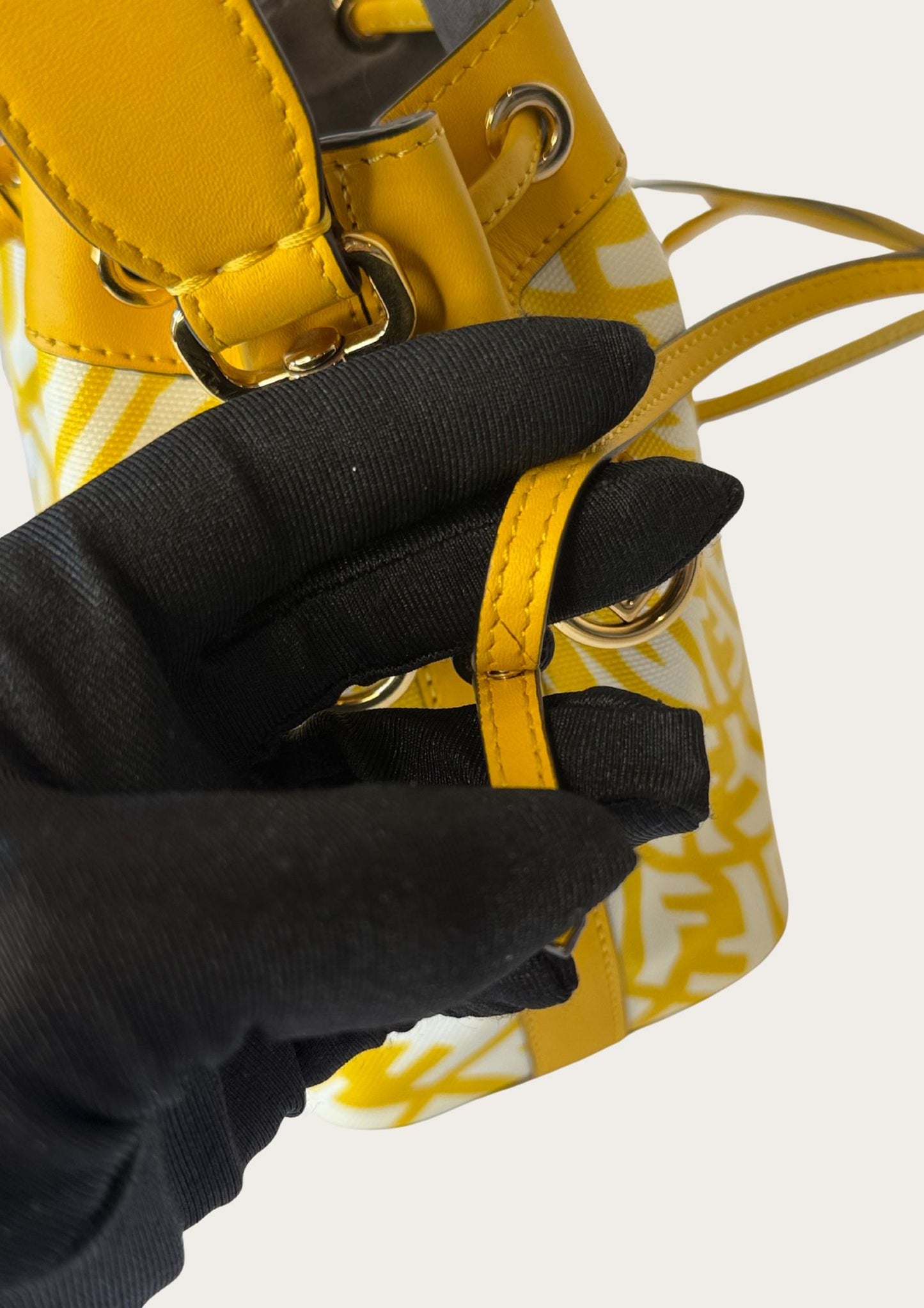 Genuine Fendi Mon Trésor Mini Bucket Bag in yellow and white canvas and leather