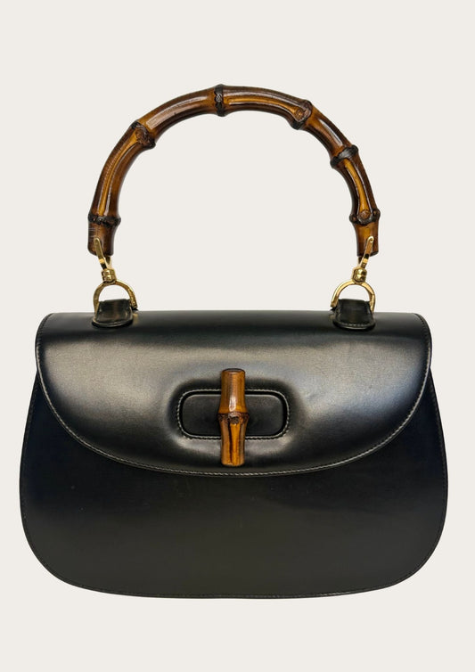 Vintage and authentic Gucci bamboo convertible black leather bag, bamboo handle.