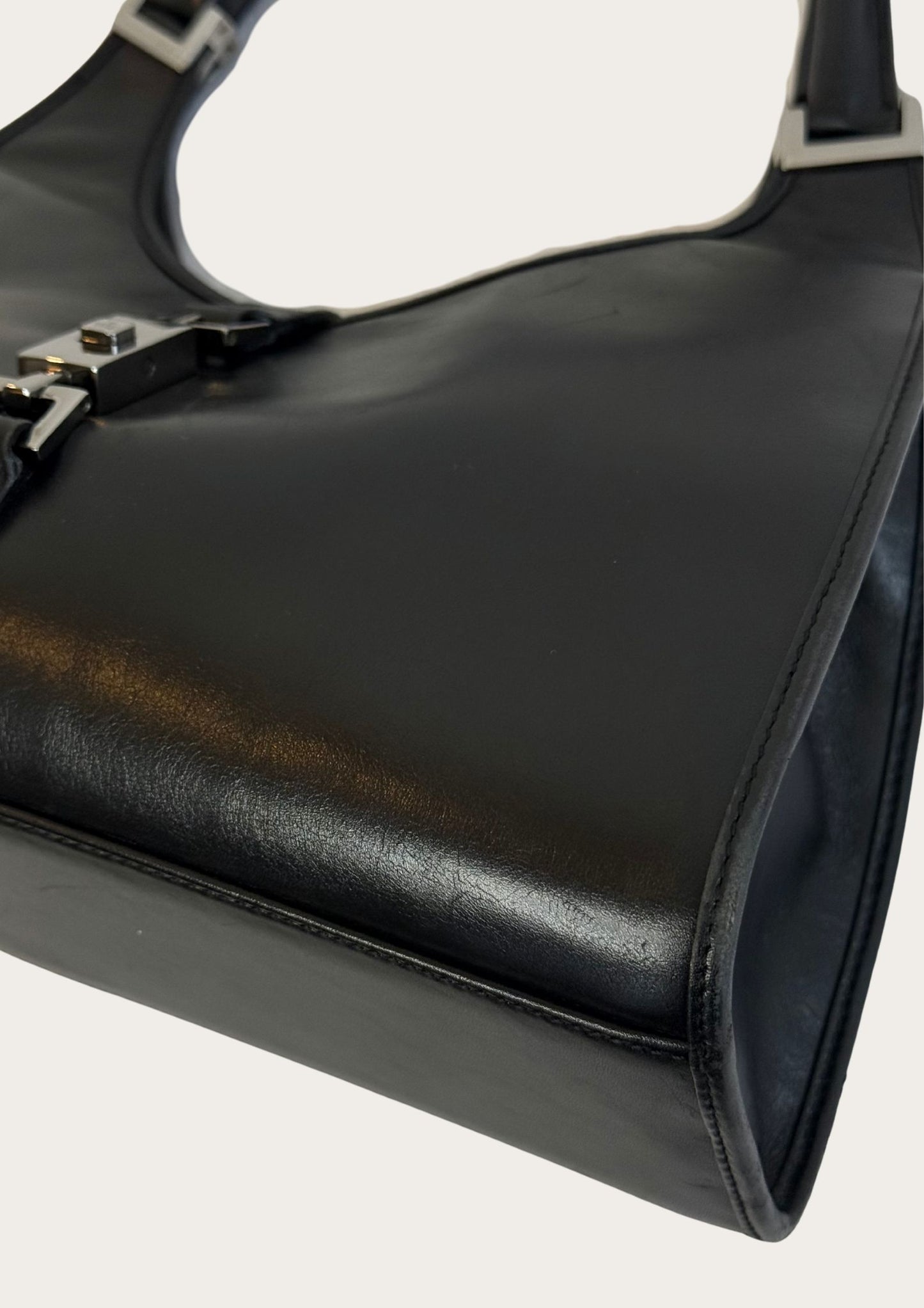 Corner of Genuine and pre-owned Gucci Jackie Bardot leather bag in black