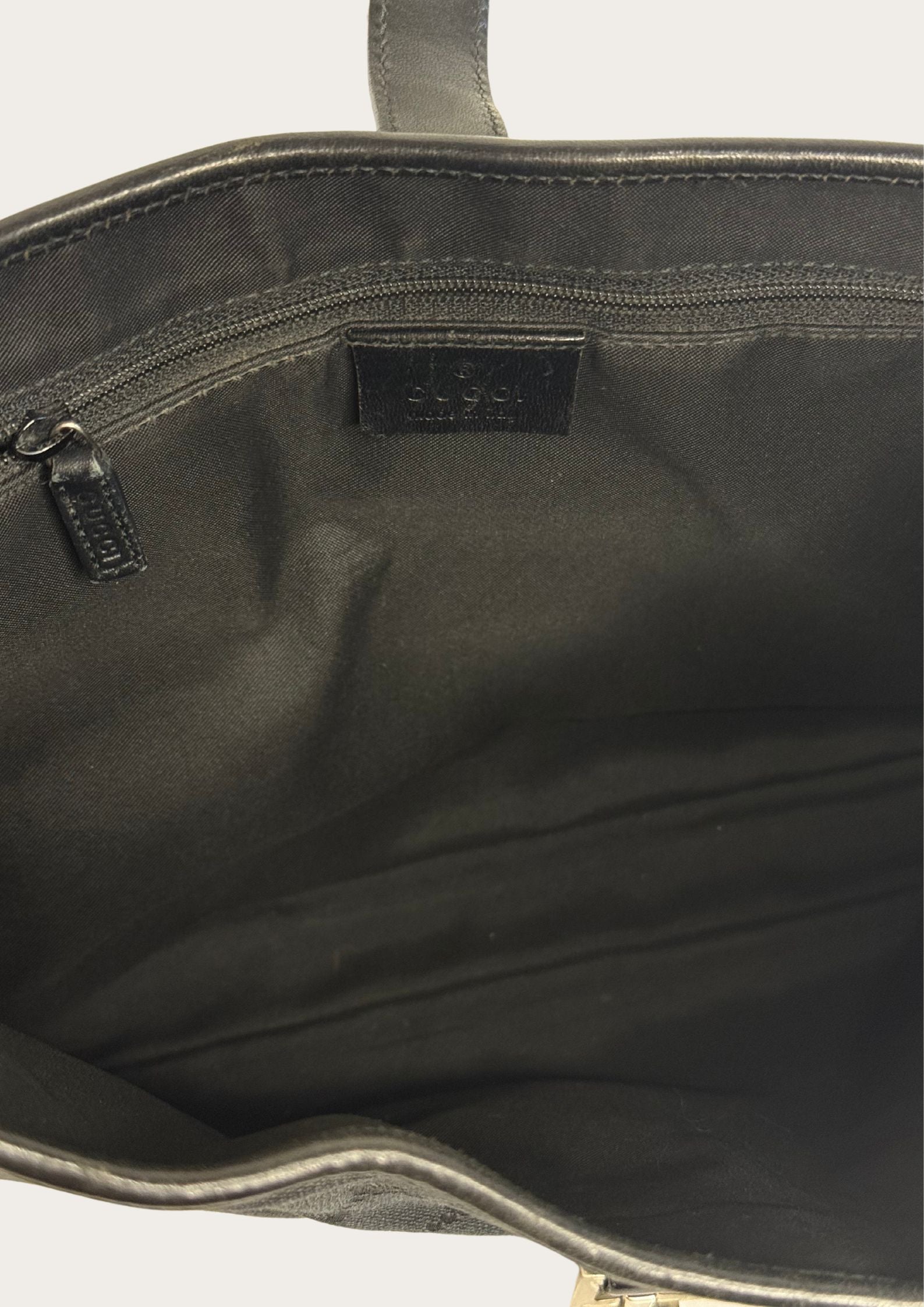 Inside of Vintage Gucci Jackie shoulder bag GG pattern, genuine
