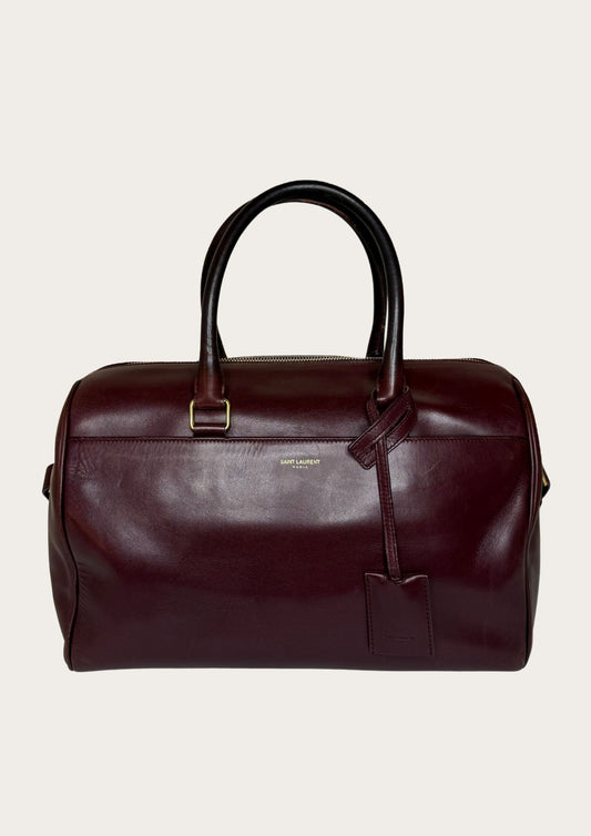 Authentic Saint Laurent Duffle bag (medium) in burgundy red