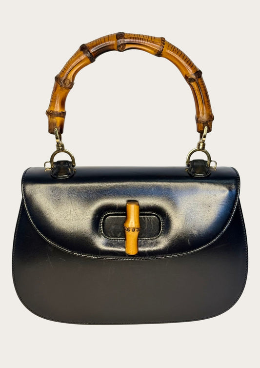 Vintage and authentic Gucci Bamboo Convertible Top Handle Bag in black leather