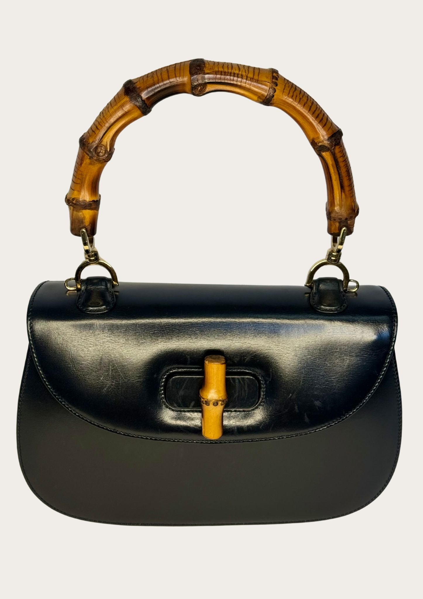 Vintage and authentic Gucci Bamboo Convertible Top Handle Bag in black leather