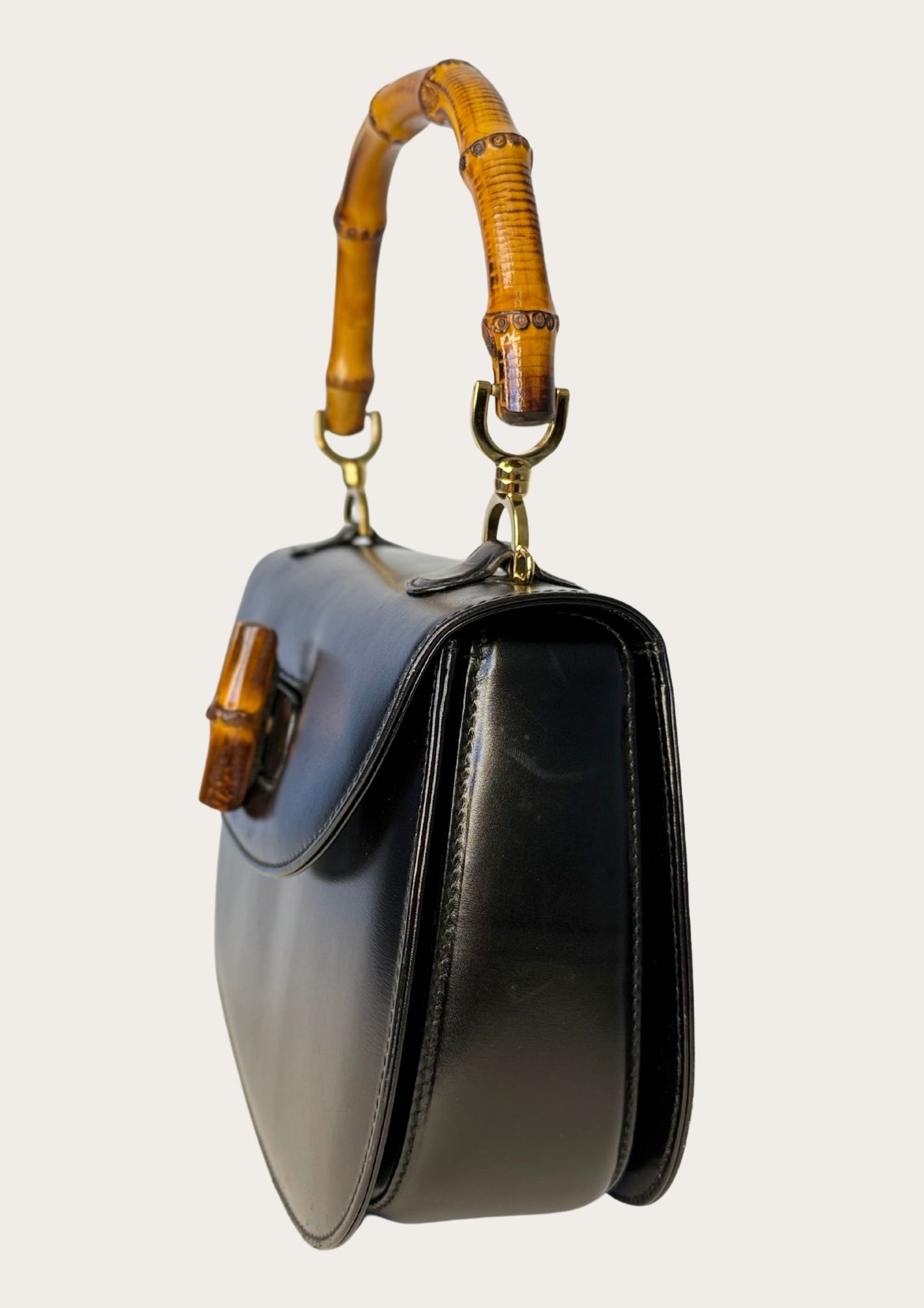 Authentic Gucci bamboo convertible in black leather and gold colored hardware