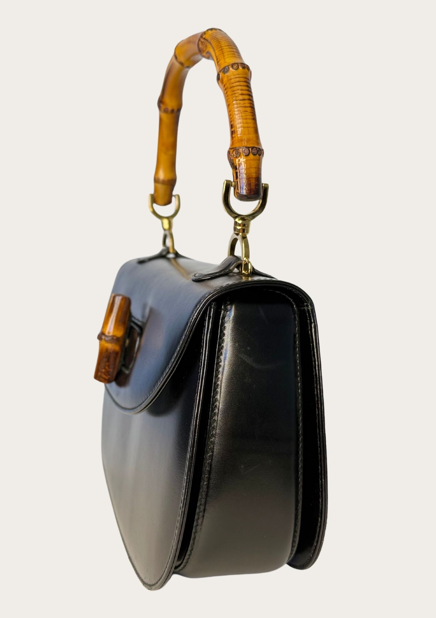 Authentic Gucci bamboo convertible in black leather and gold colored hardware