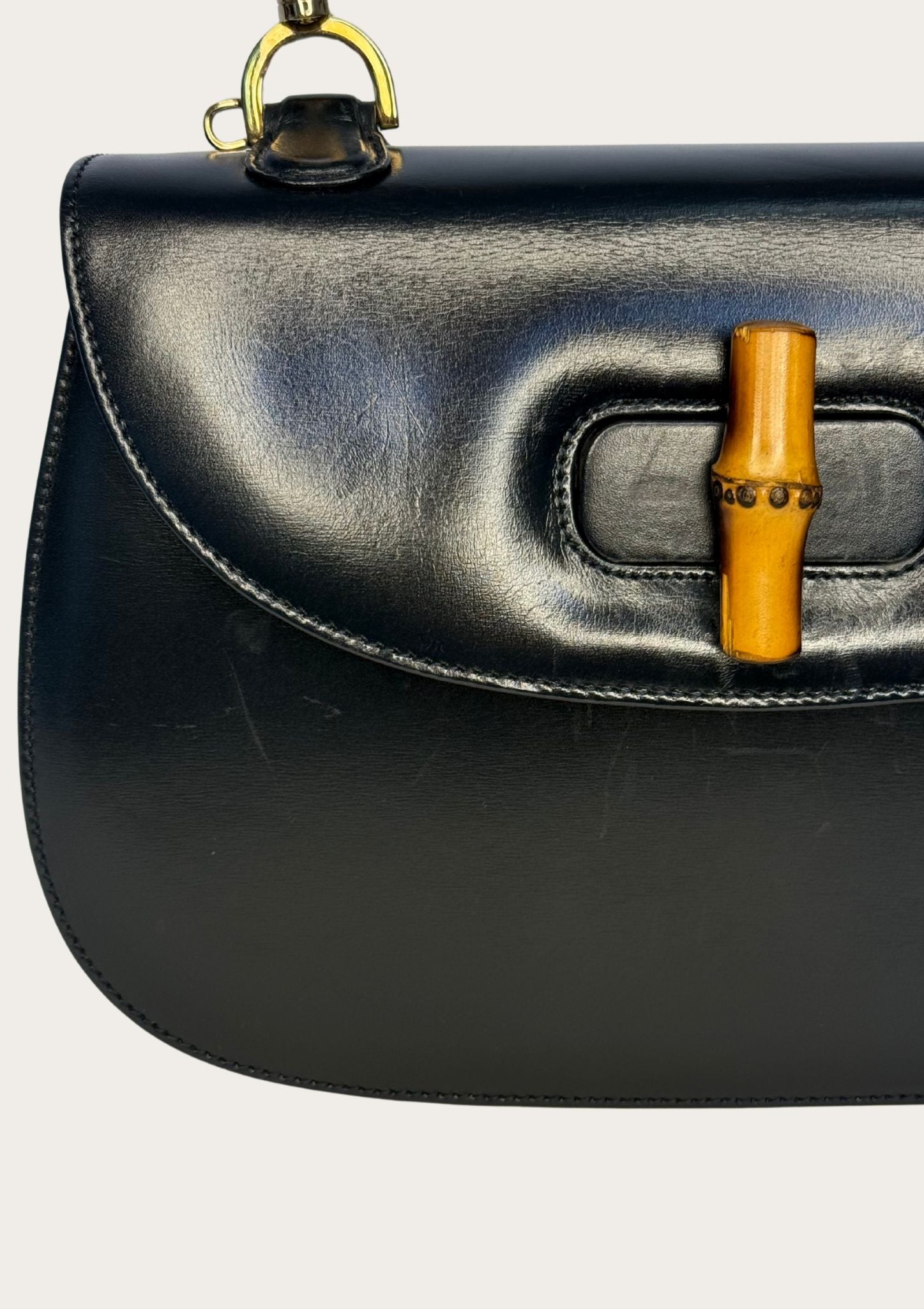 Vintage and authentic Gucci Bamboo Convertible Top Handle Bag in black leather