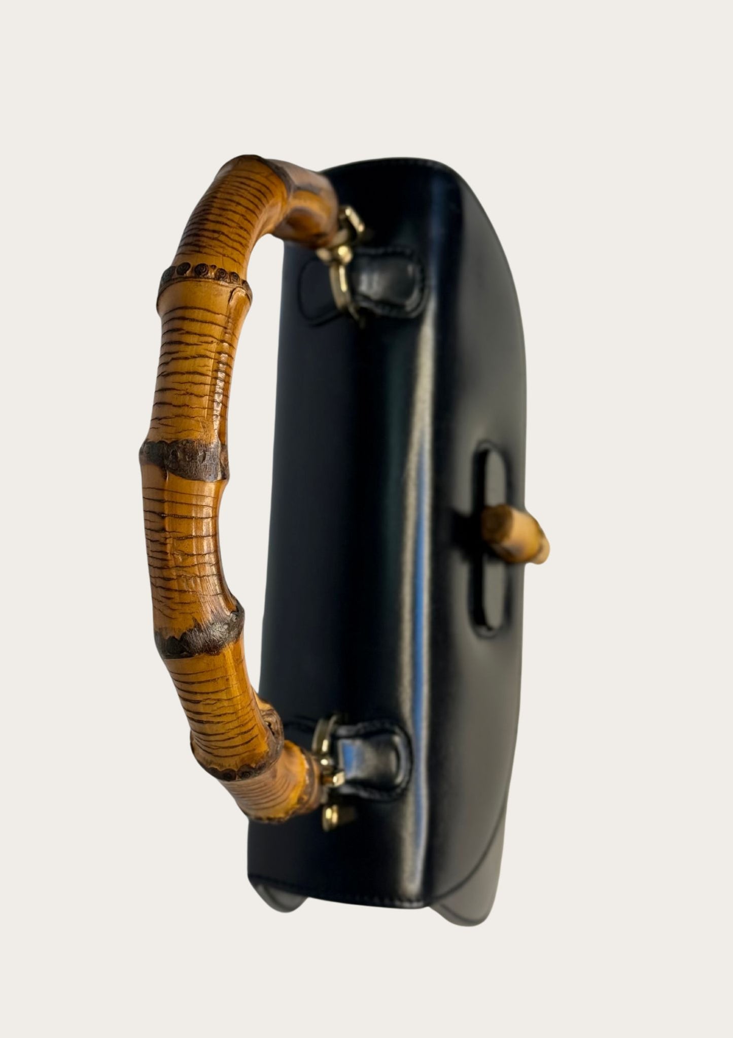 Vintage and authentic Gucci Bamboo Convertible Top Handle Bag in black leather