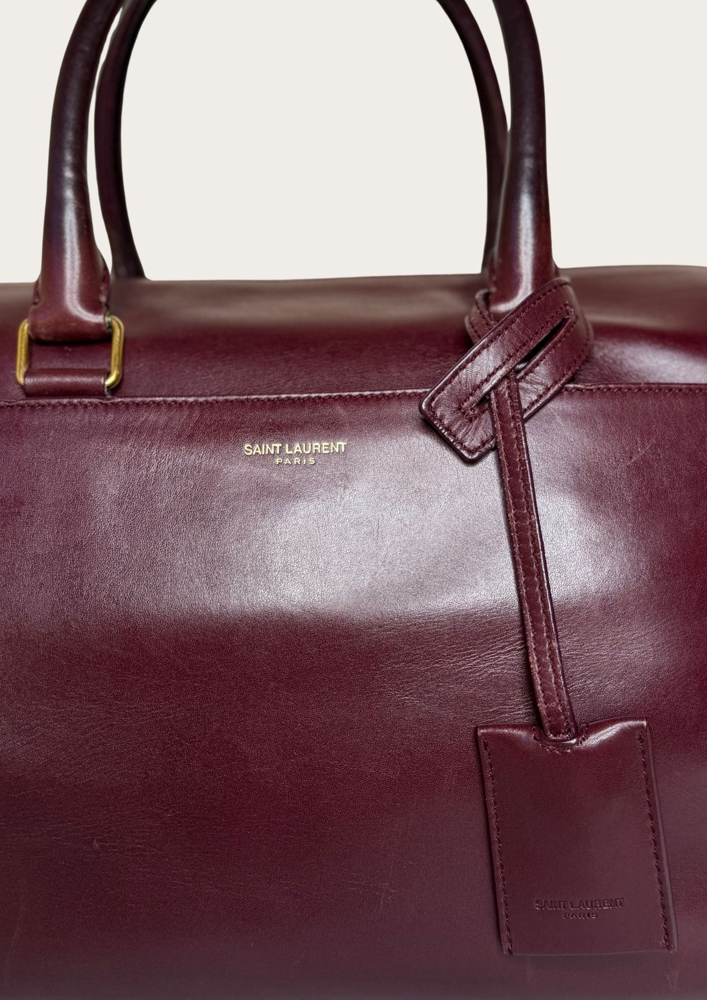 Authentic Saint Laurent Duffle bag (medium) in burgundy red