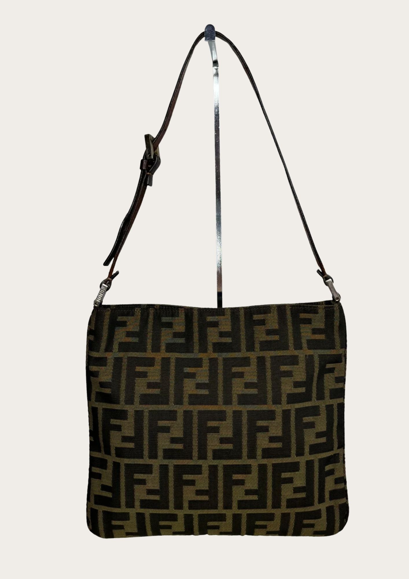 Backside of Fendi Zucca shoulder bag with leather strap, brown.