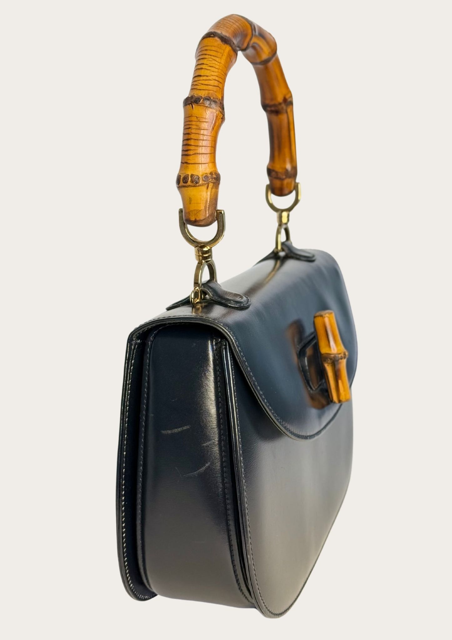 Vintage and authentic Gucci Bamboo Convertible Top Handle Bag in black leather