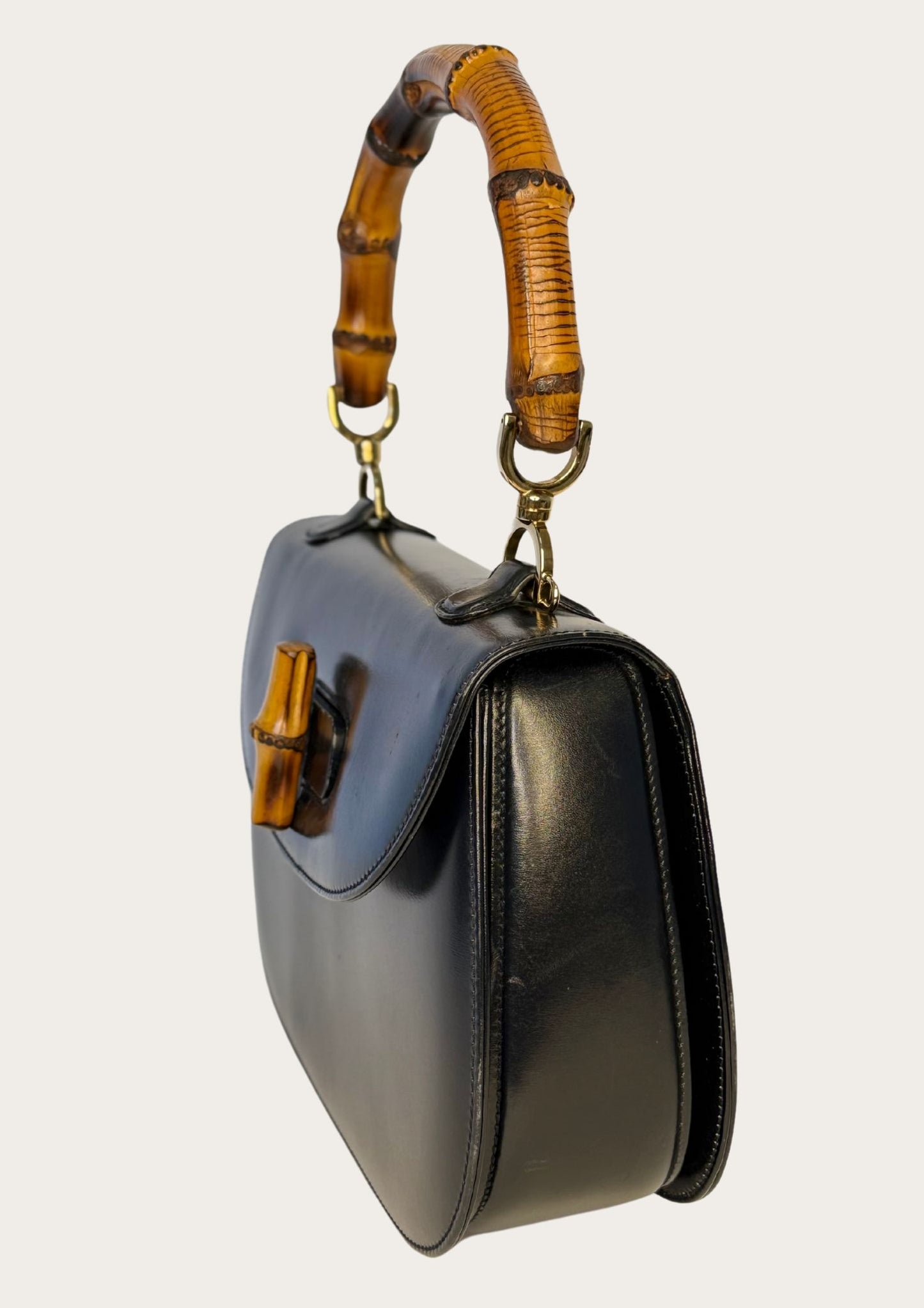 Vintage and authentic Gucci Bamboo Convertible Top Handle Bag in black leather