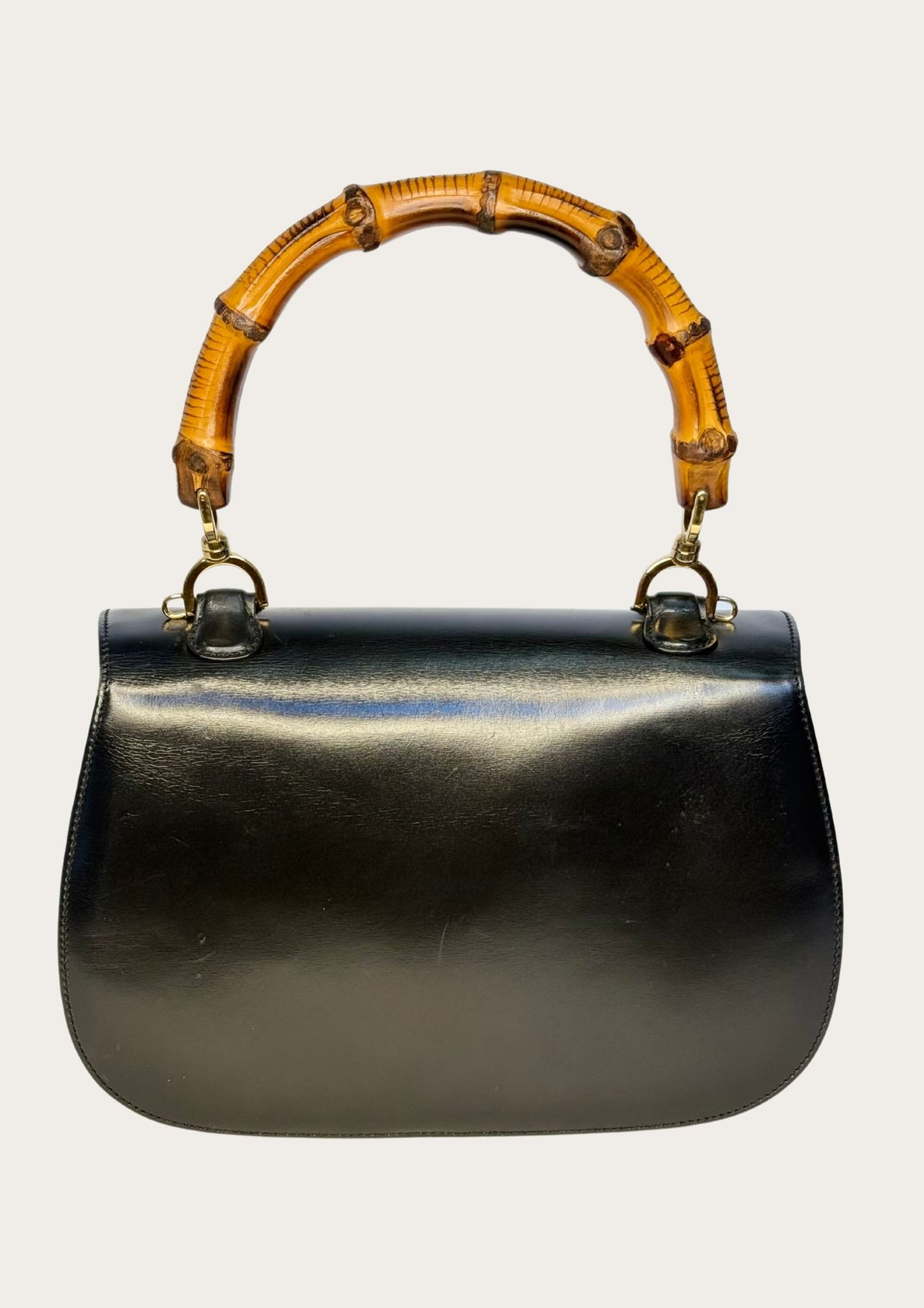 Vintage and authentic Gucci Bamboo Convertible Top Handle Bag in black leather