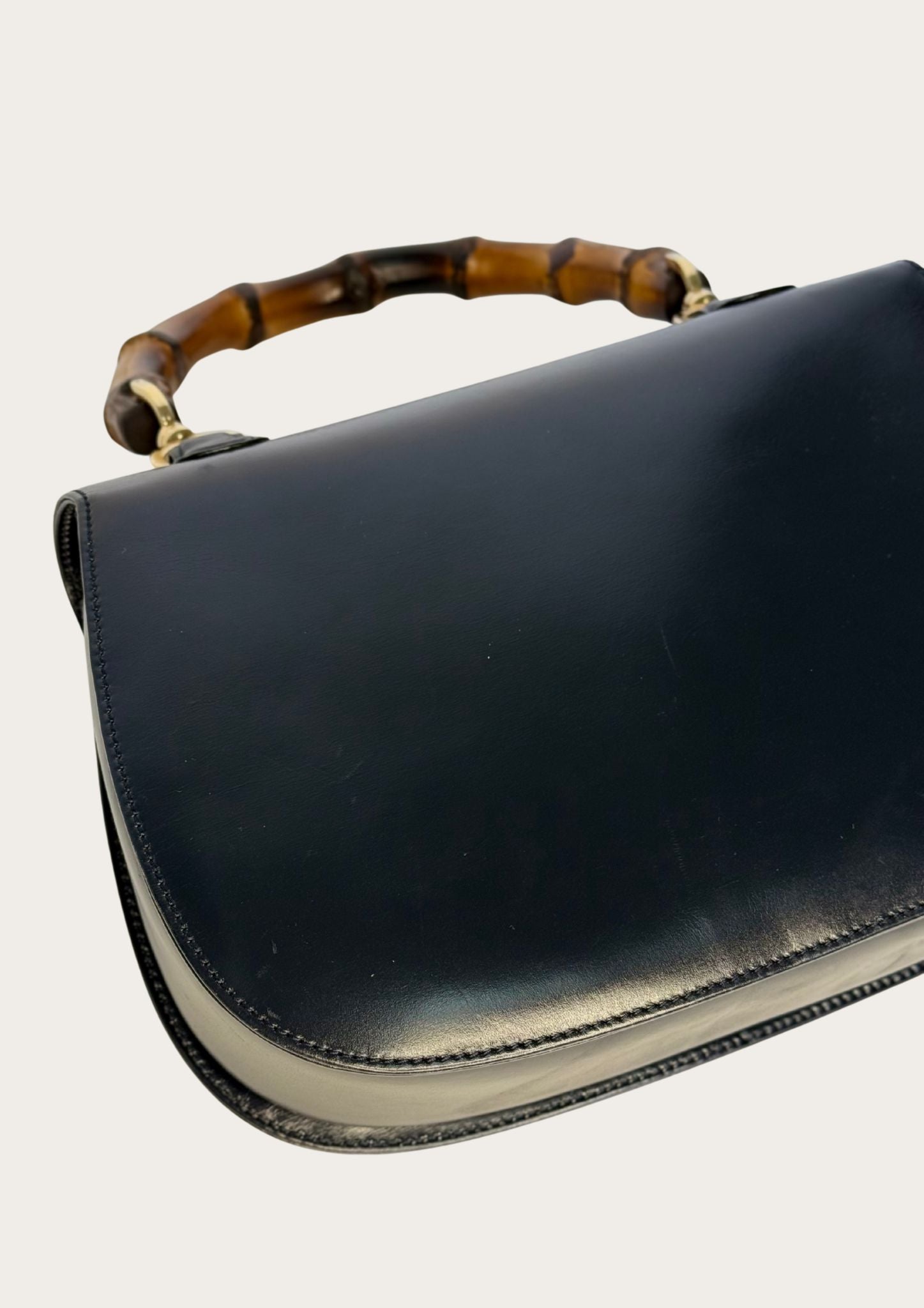 Vintage and authentic Gucci Bamboo Convertible Top Handle Bag in black leather
