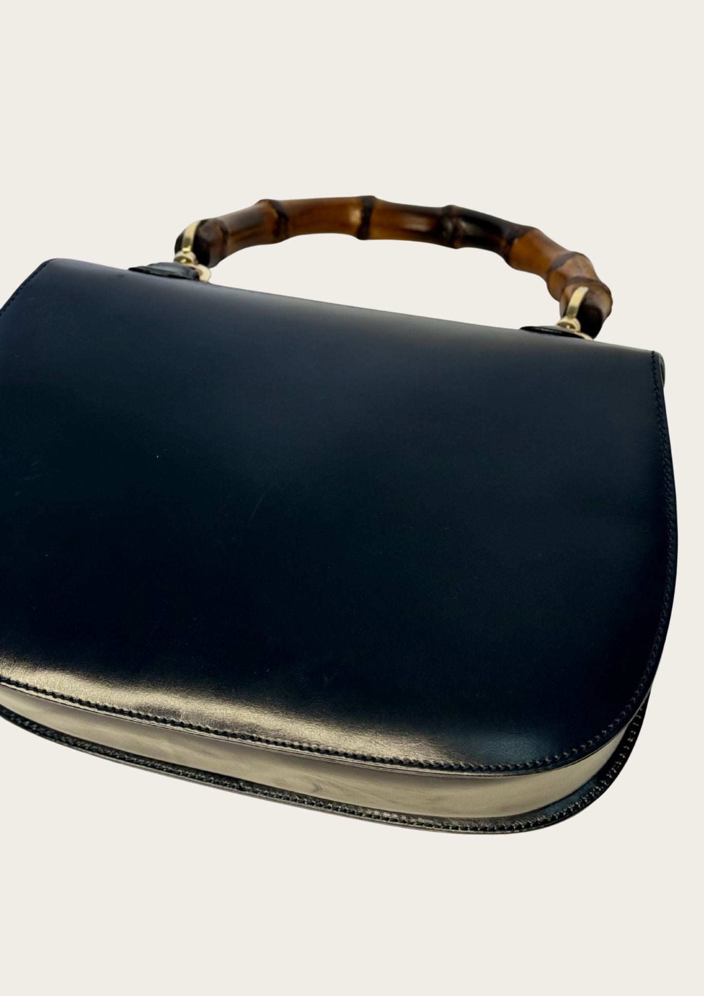 Vintage and authentic Gucci Bamboo Convertible Top Handle Bag in black leather