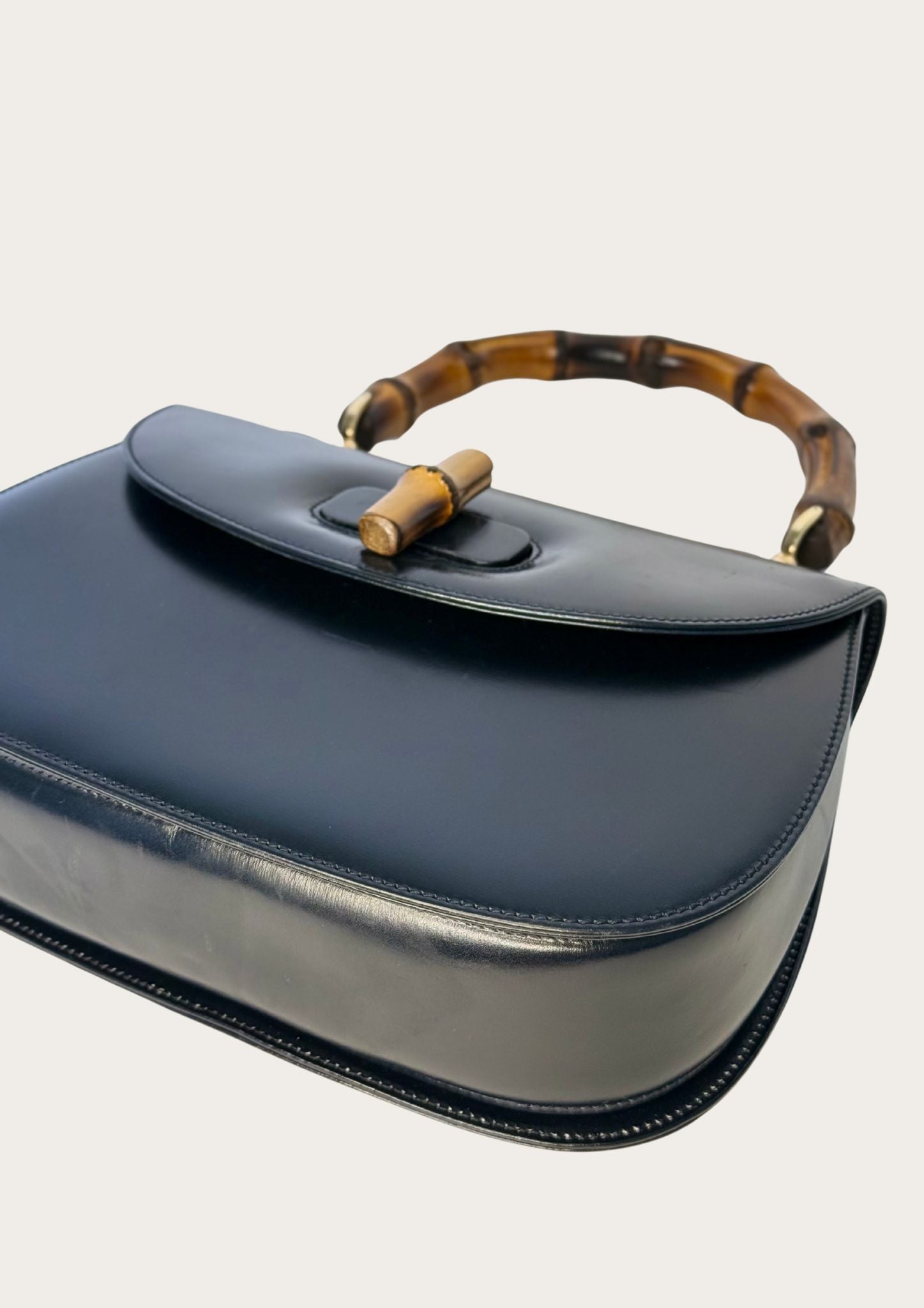 Vintage and authentic Gucci Bamboo Convertible Top Handle Bag in black leather