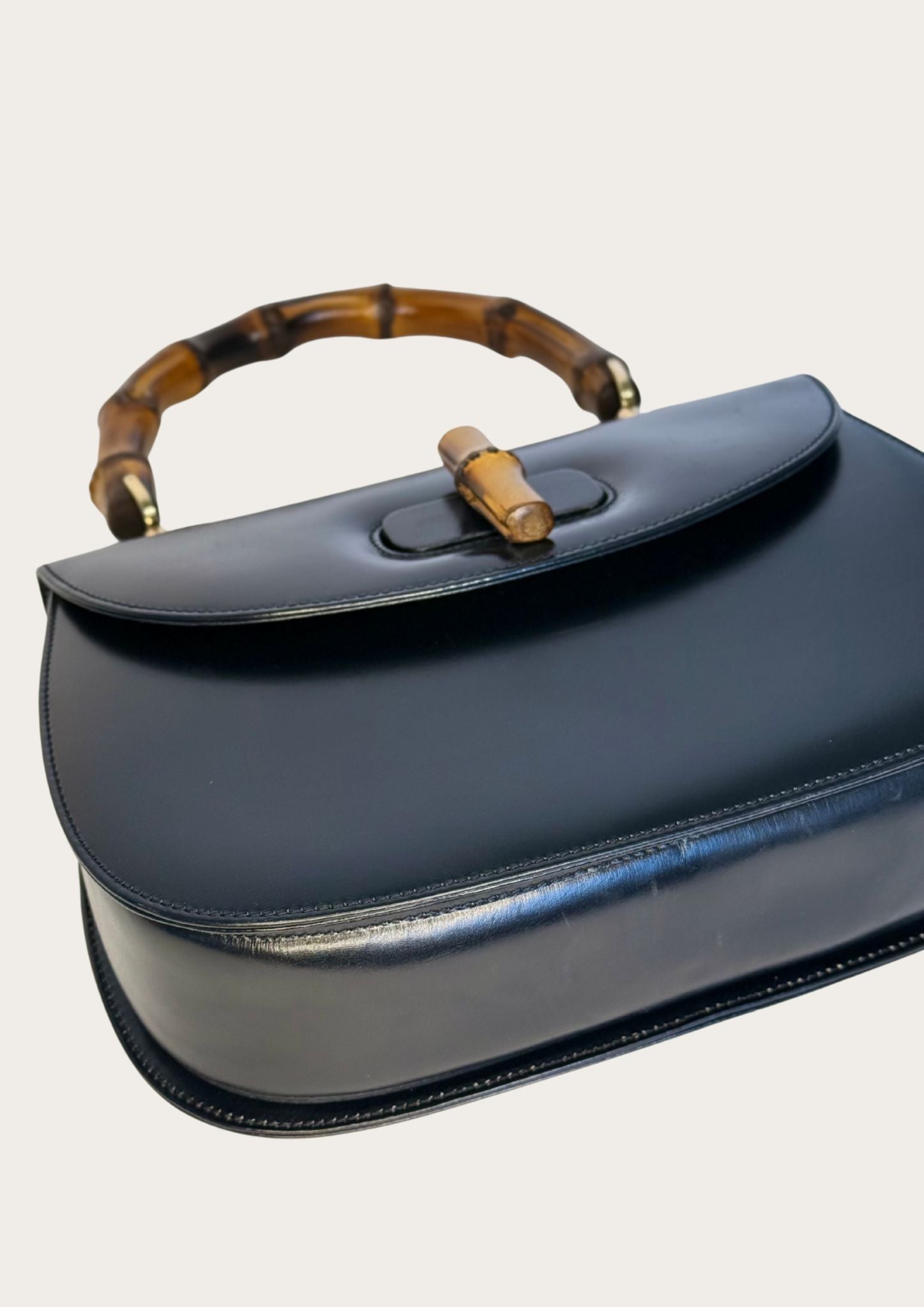 Vintage and authentic Gucci Bamboo Convertible Top Handle Bag in black leather