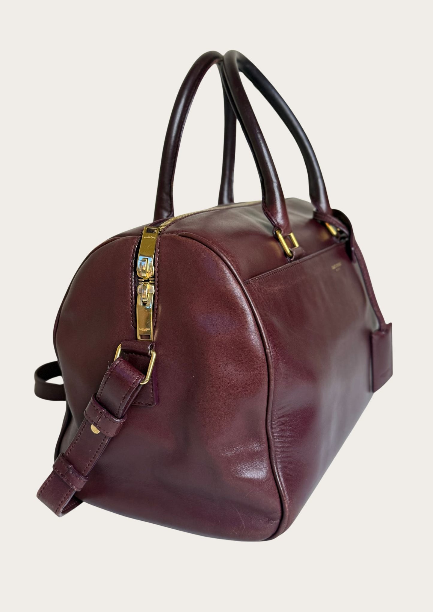 Authentic Saint Laurent Duffle bag (medium) in burgundy red