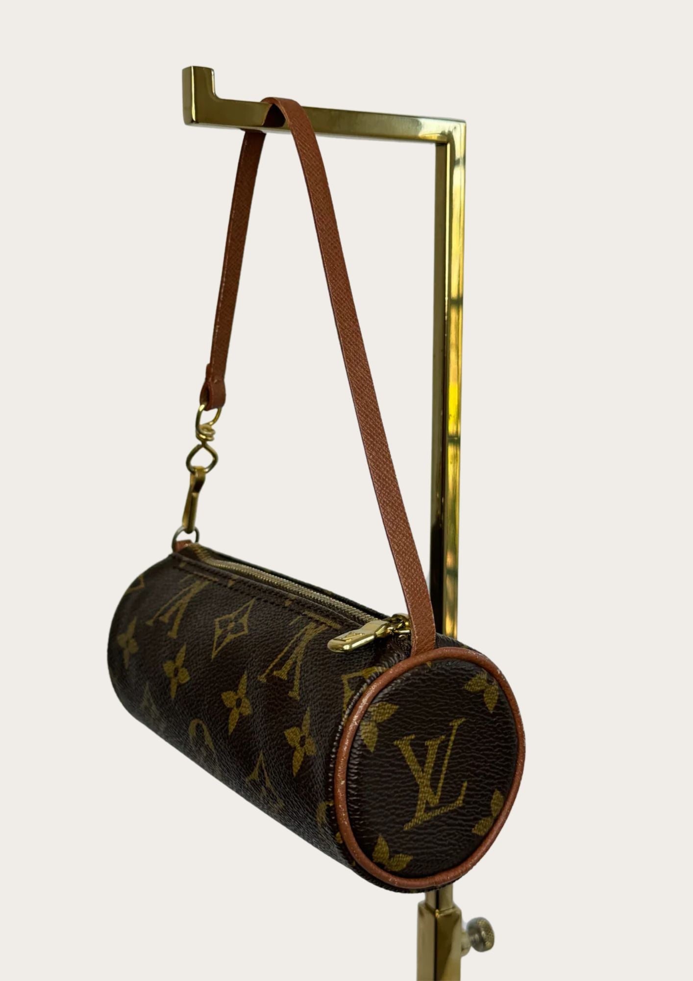 Genuine Louis Vuitton Papillon pouch in leather monogram, side.