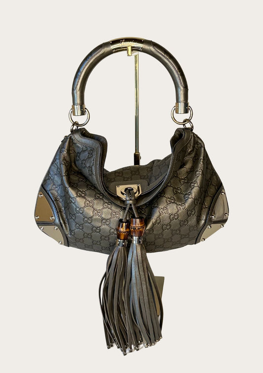 Authentic Gucci Indy bag in Guccissima leather 