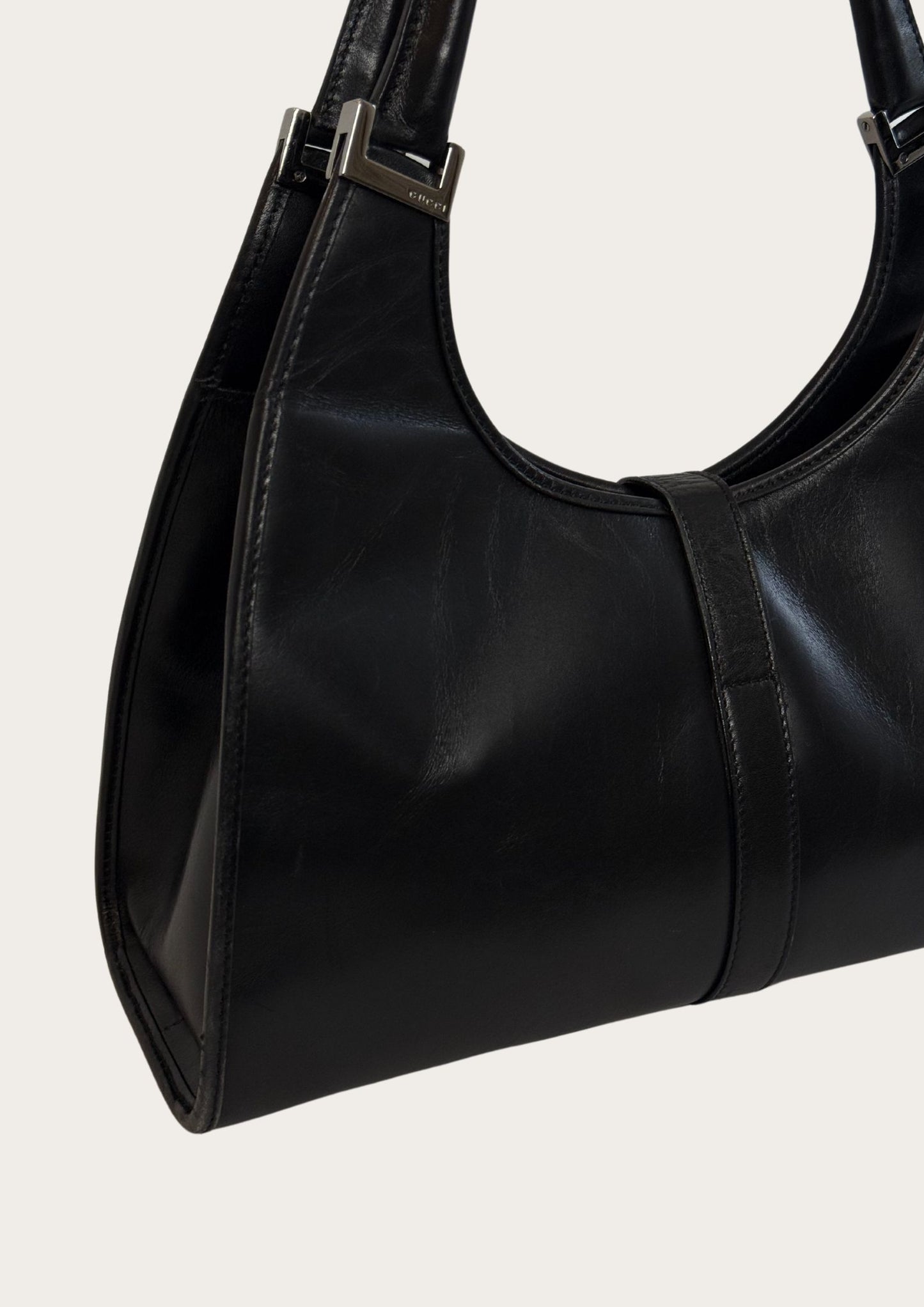 Genuine and pre-owned Gucci Jackie Bardot leather bag in black, side