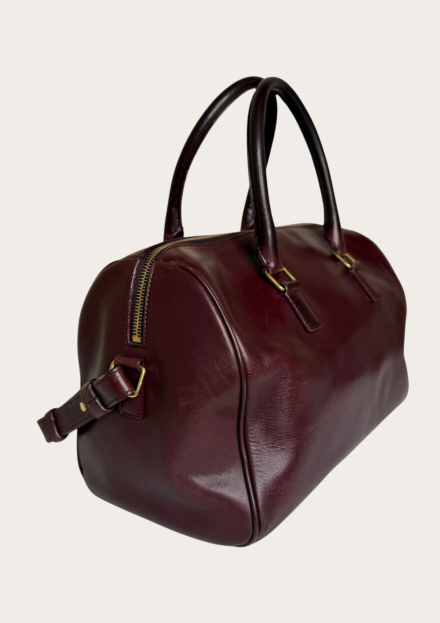 Authentic Saint Laurent Duffle bag (medium) in burgundy red