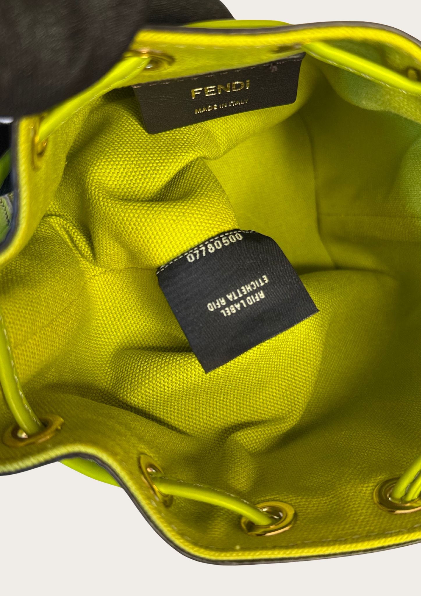 Authentic Fendi Mon Trésor Mini Bucket Bag in green canvas with leather details