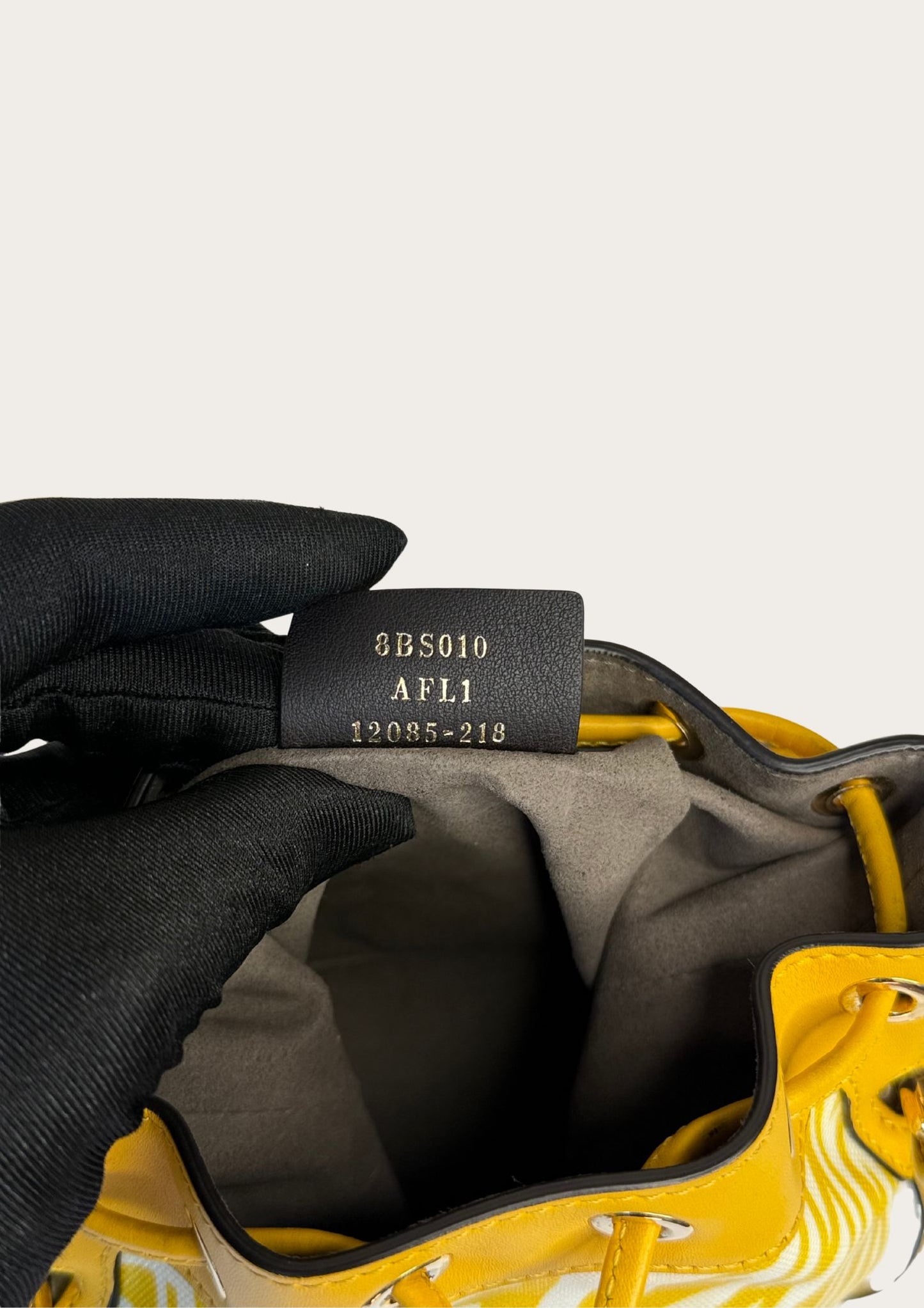 Genuine Fendi Mon Trésor Mini Bucket Bag in yellow and white canvas and leather