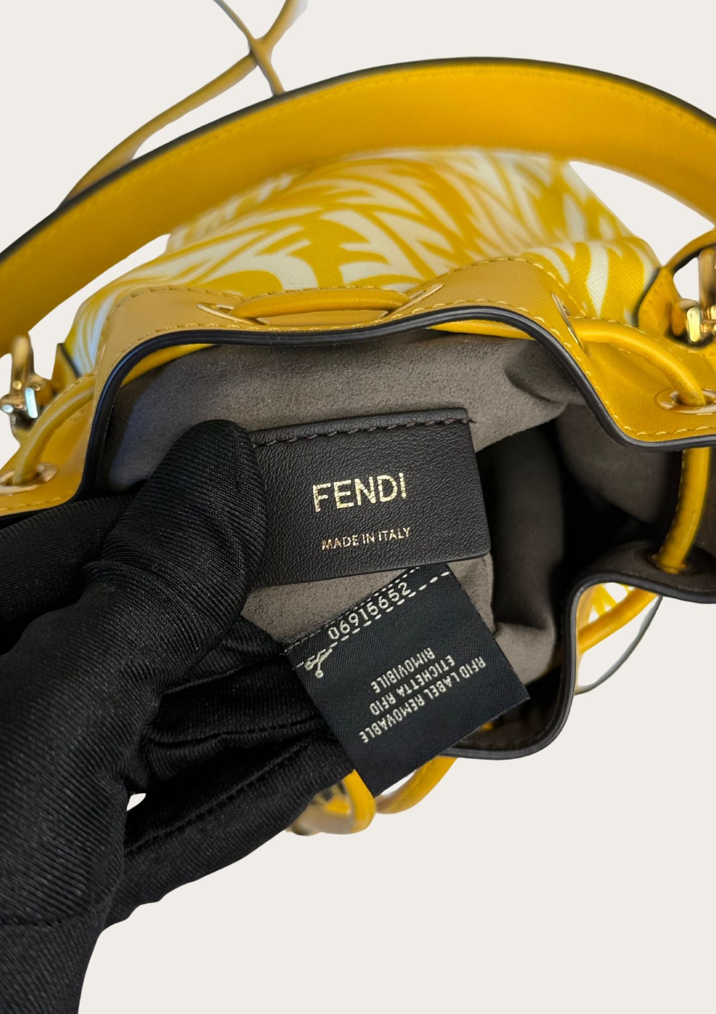 Genuine Fendi Mon Trésor Mini Bucket Bag in yellow and white canvas and leather