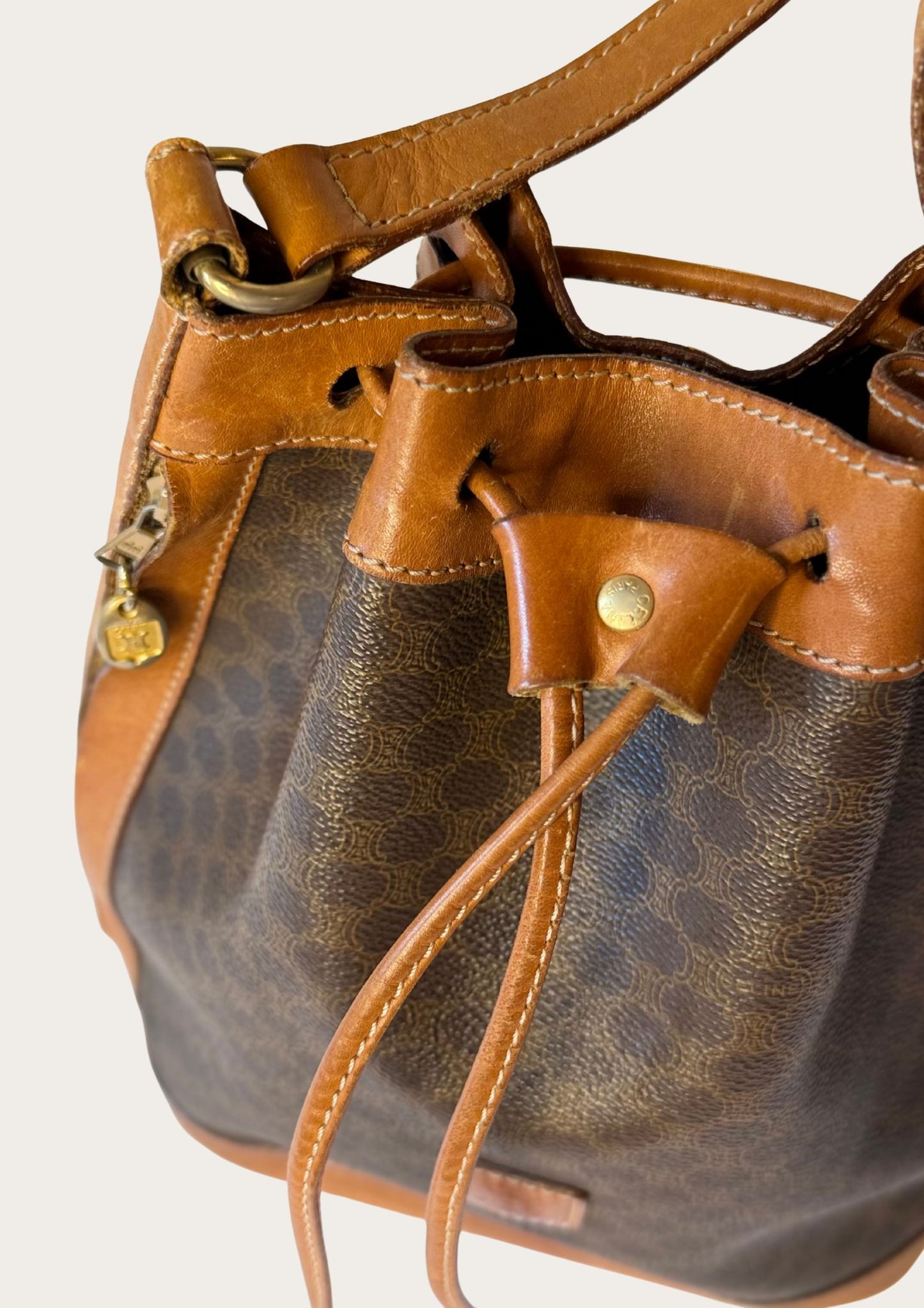 Genuine Celine bucket bag in macadam pattern with leather details