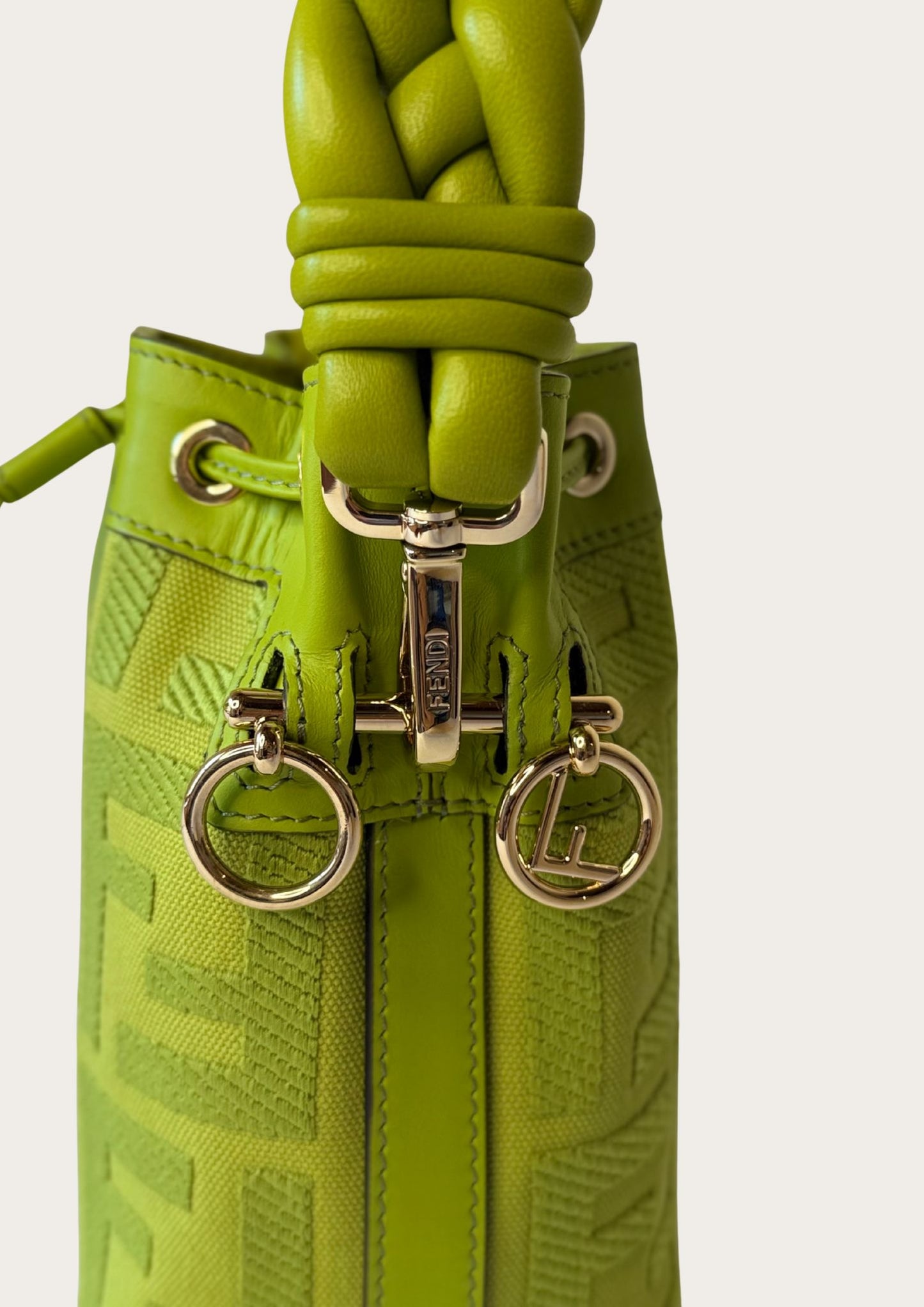 Authentic Fendi Mon Trésor Mini Bucket Bag in green canvas with leather details