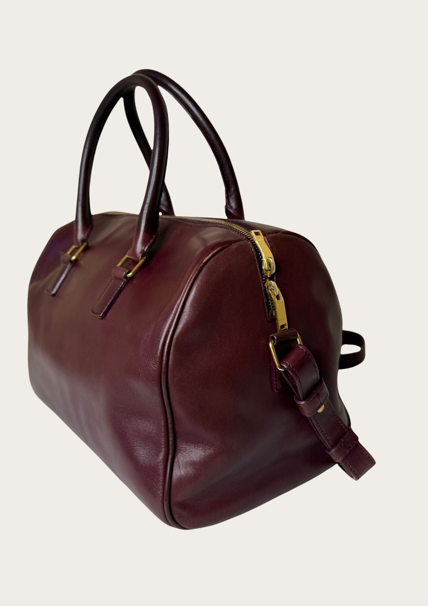 Authentic Saint Laurent Duffle bag (medium) in burgundy red