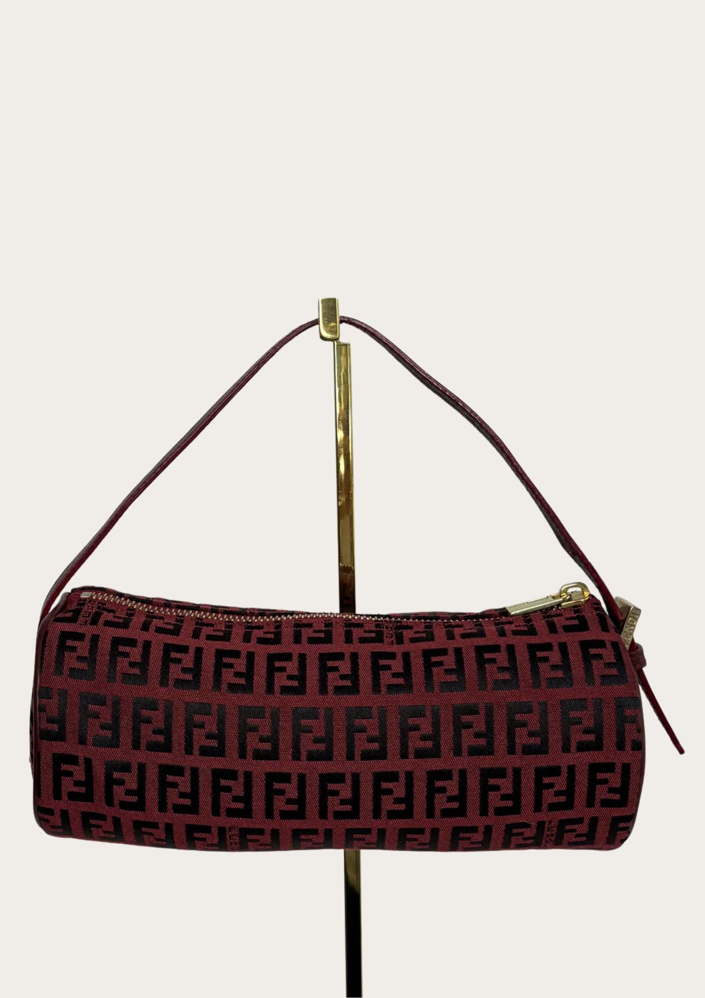100% authentic Fendi Zucchino barrel bag in burgundy red, front.